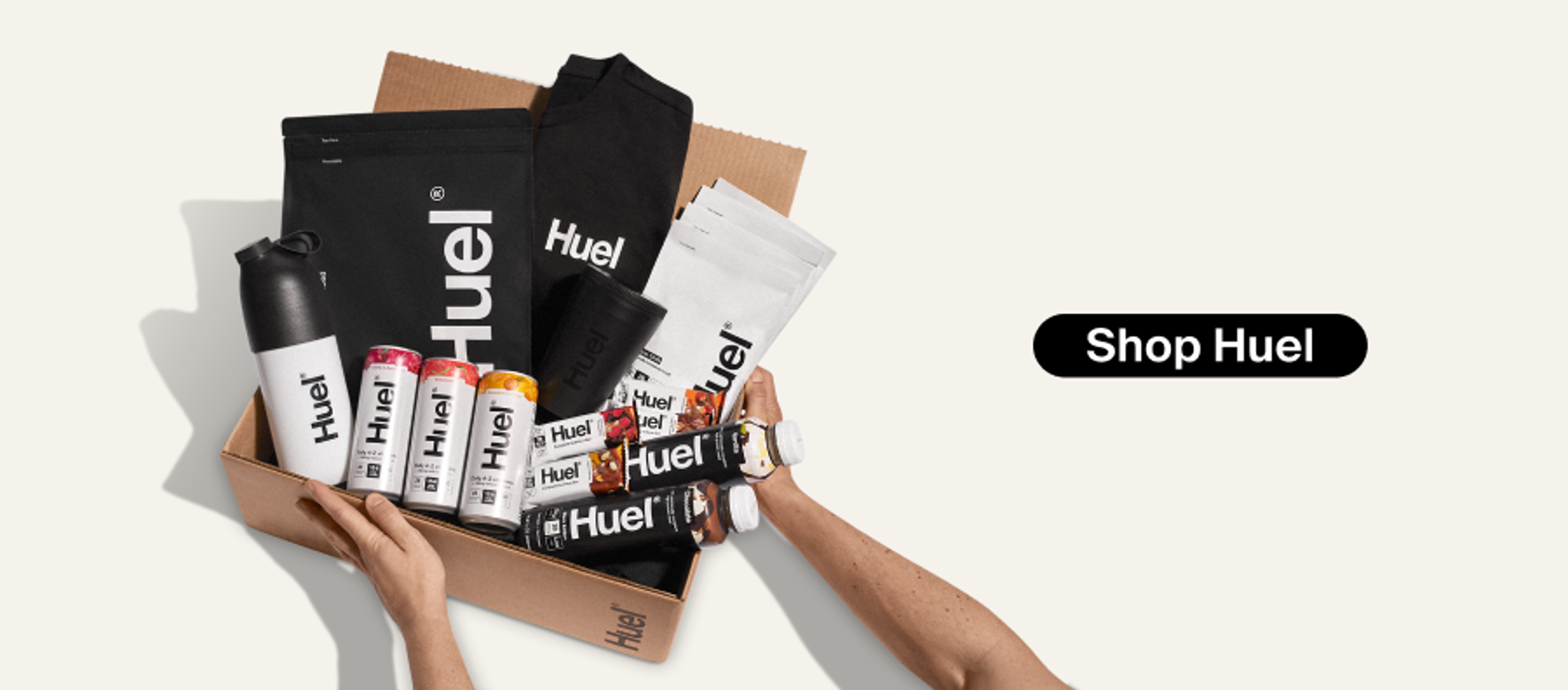 Shop Huel Button with image of arms reaching out and holding a Huel product bundle