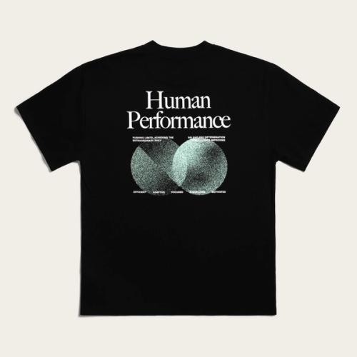 A black Huel T-shirt with "Human Performance" on it with green circle additions