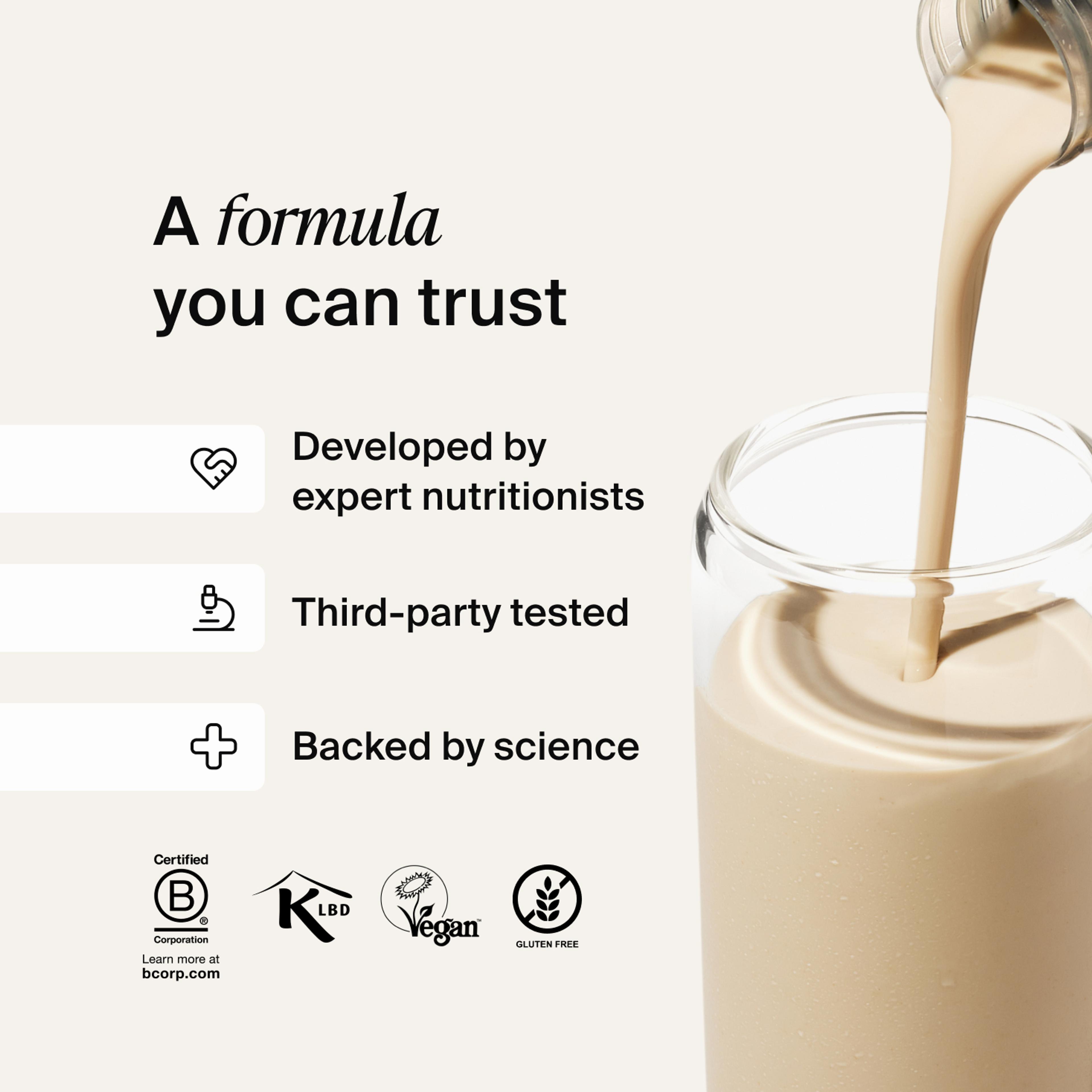 Huel RTD protein drink being poured into a glass filled with ice