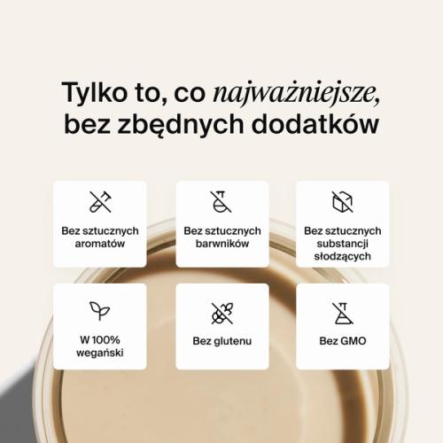 Above shot of a glass of Huel RTD on a neutral colour background