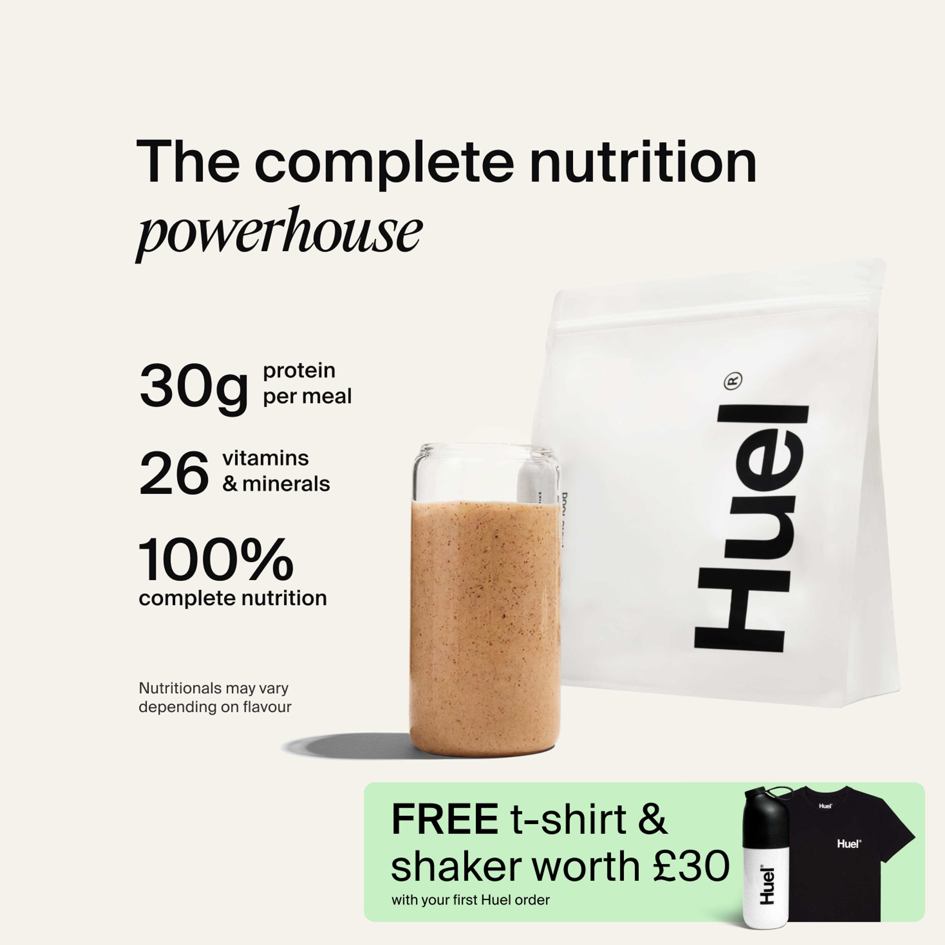 A bag of Huel powder next to a glass containing a Huel drink on a neutral background