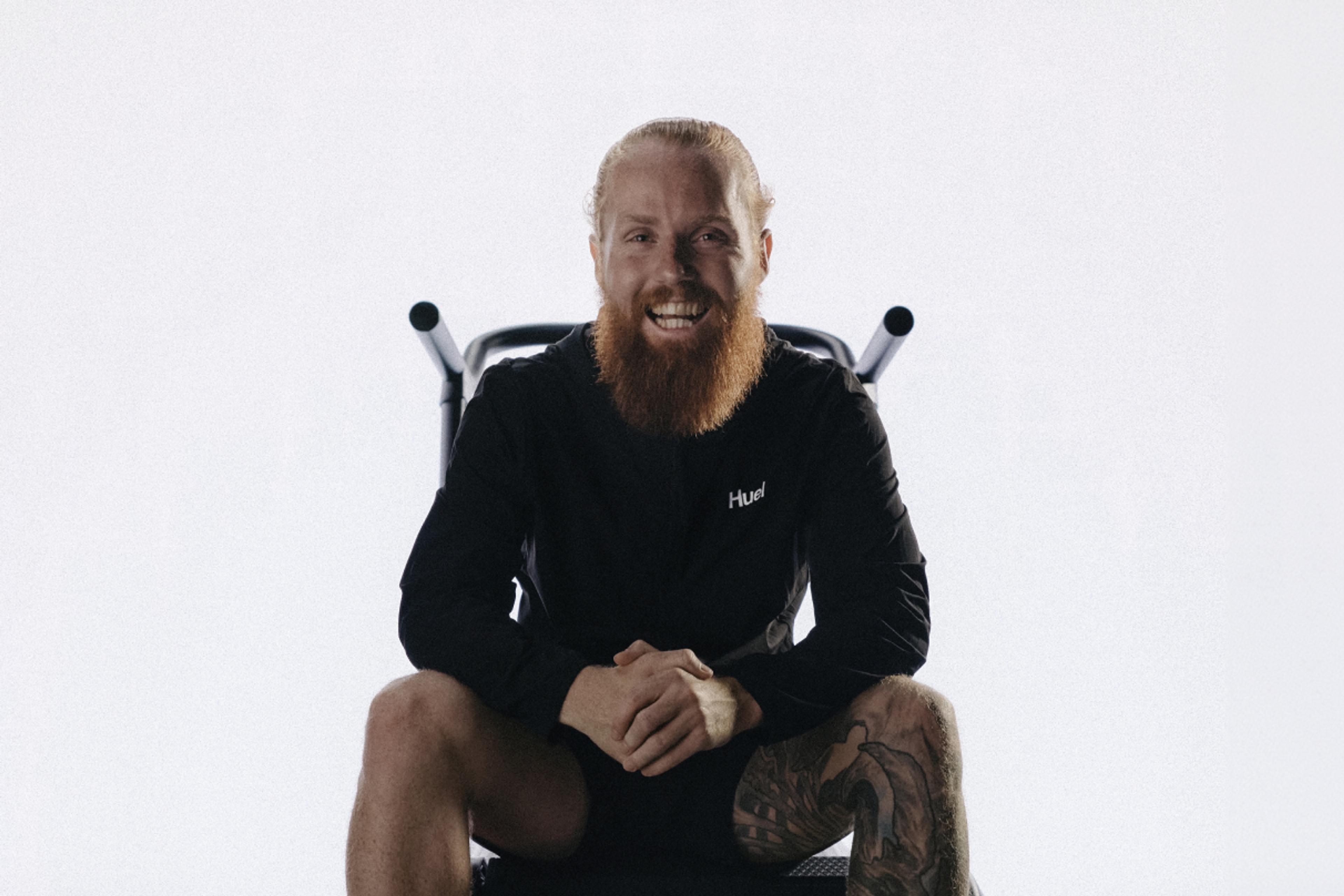 Russ Cook Hardest Geezer sat in a chair