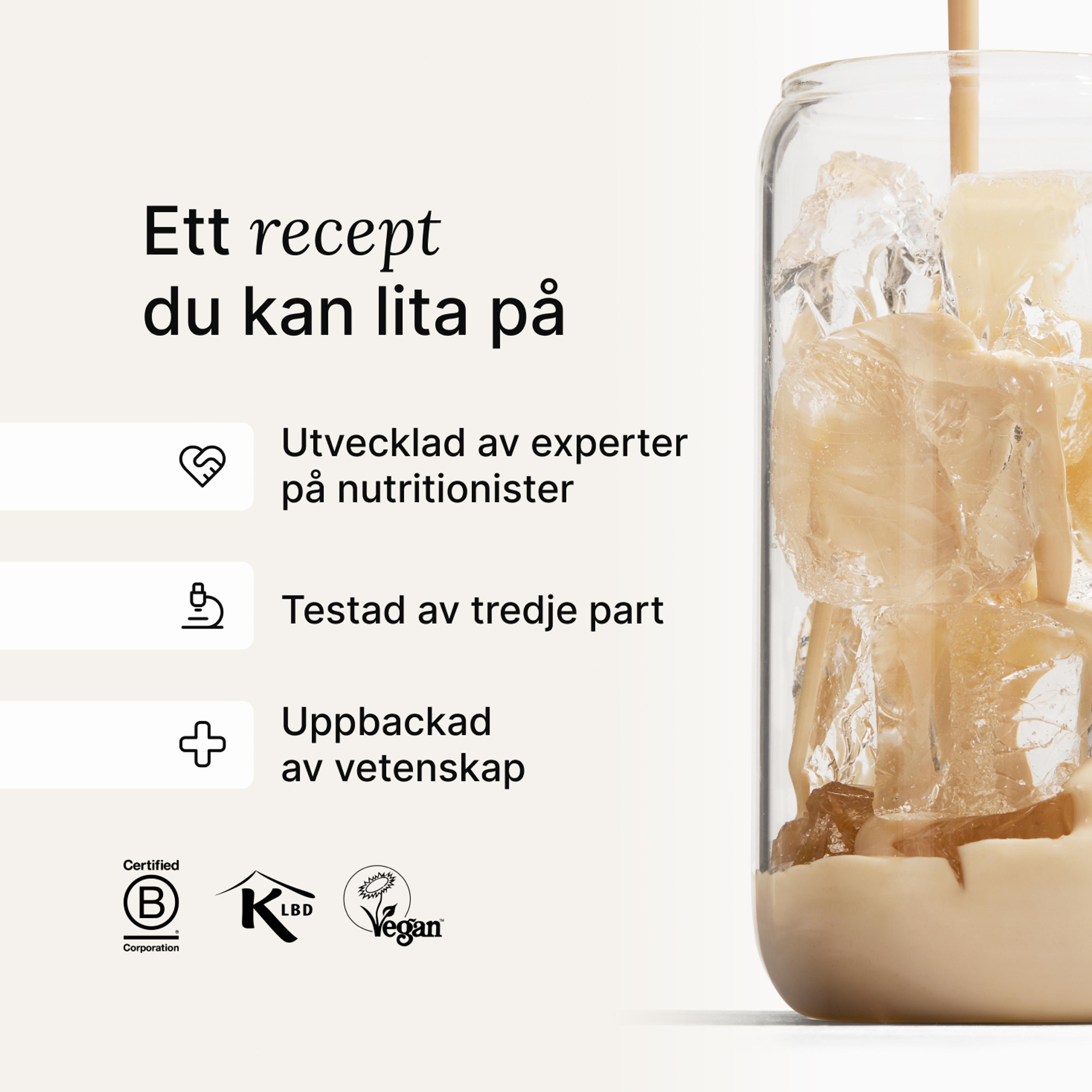 Huel vanilla shake being poured into a glass with ice, against a neutral background