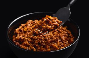Close-up of H&S Mexican Chilli in a bowl set against a black background