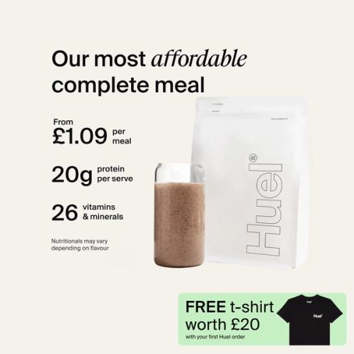 A white pouch of Huel Essential and a Huel shaker on a neutral colour background