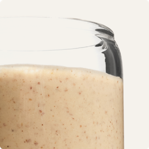 A glass containing Huel Powder