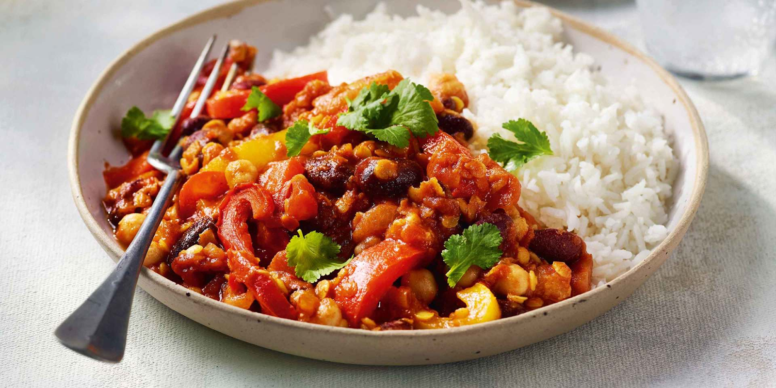 mexican veggie chilli in a bowl with a fork