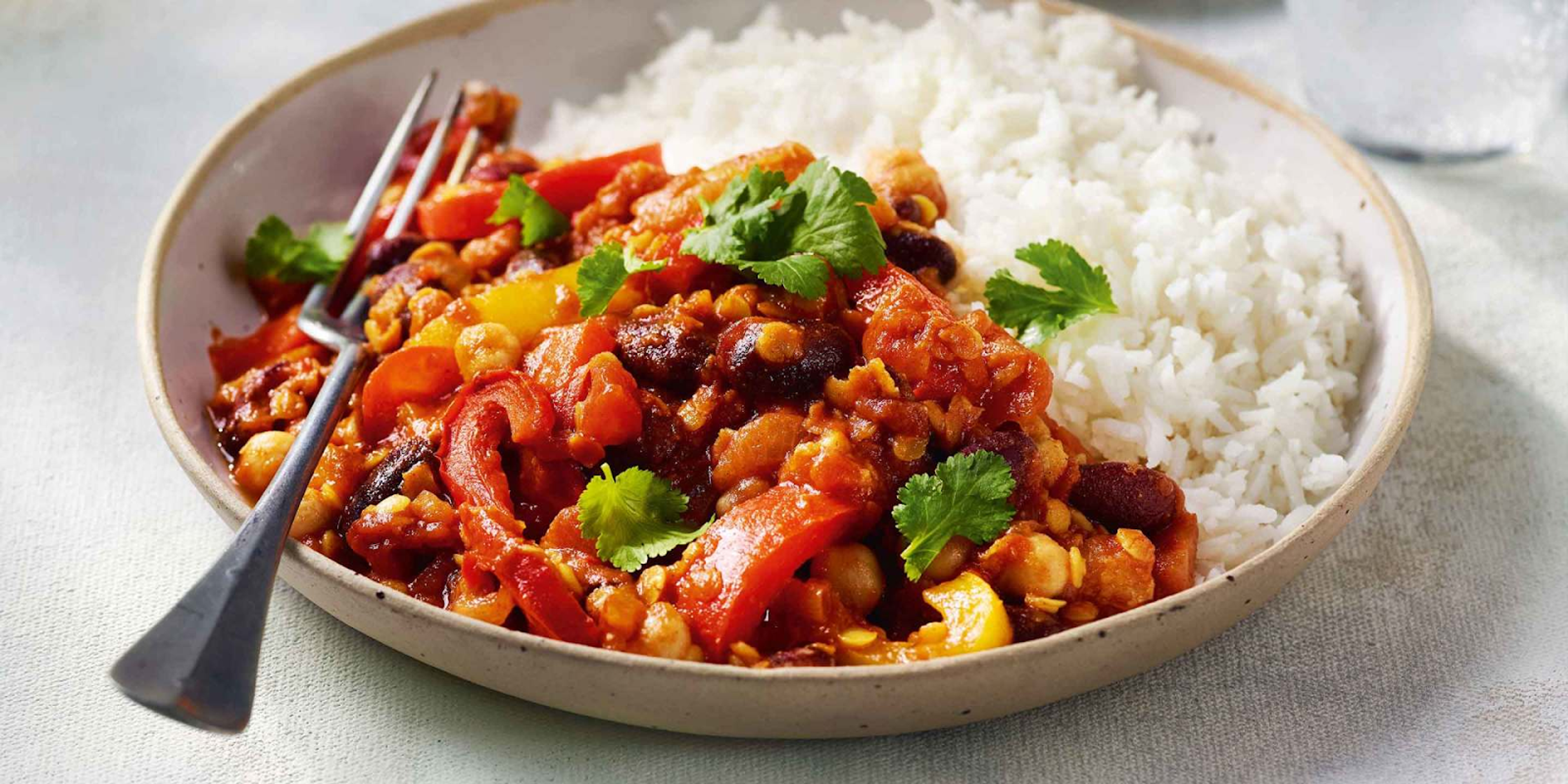 mexican veggie chilli in a bowl with a fork