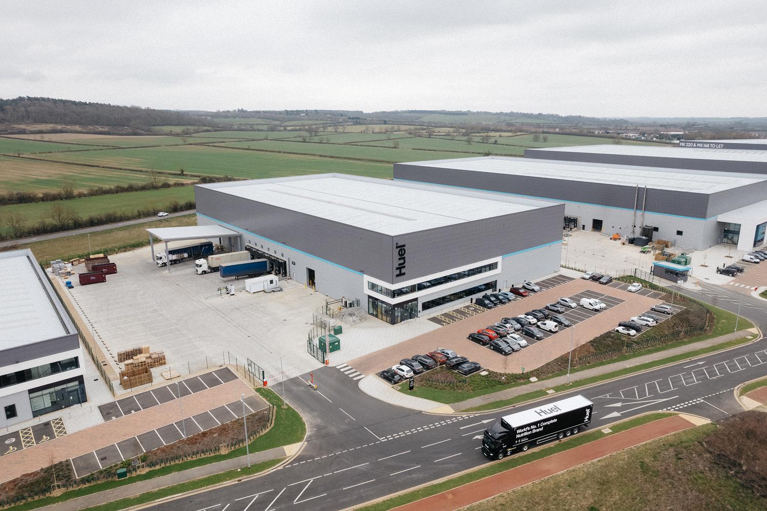 Two Huel employees cheering 2 Huel samples