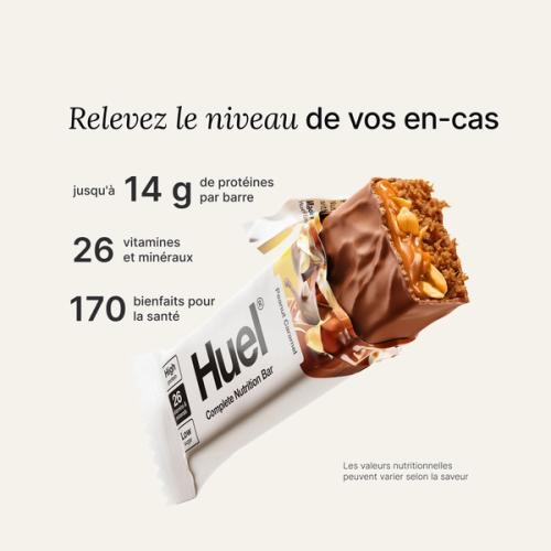 A Huel Complete Nutrition bar with a peanut and caramel filling, set against a beige-colour background