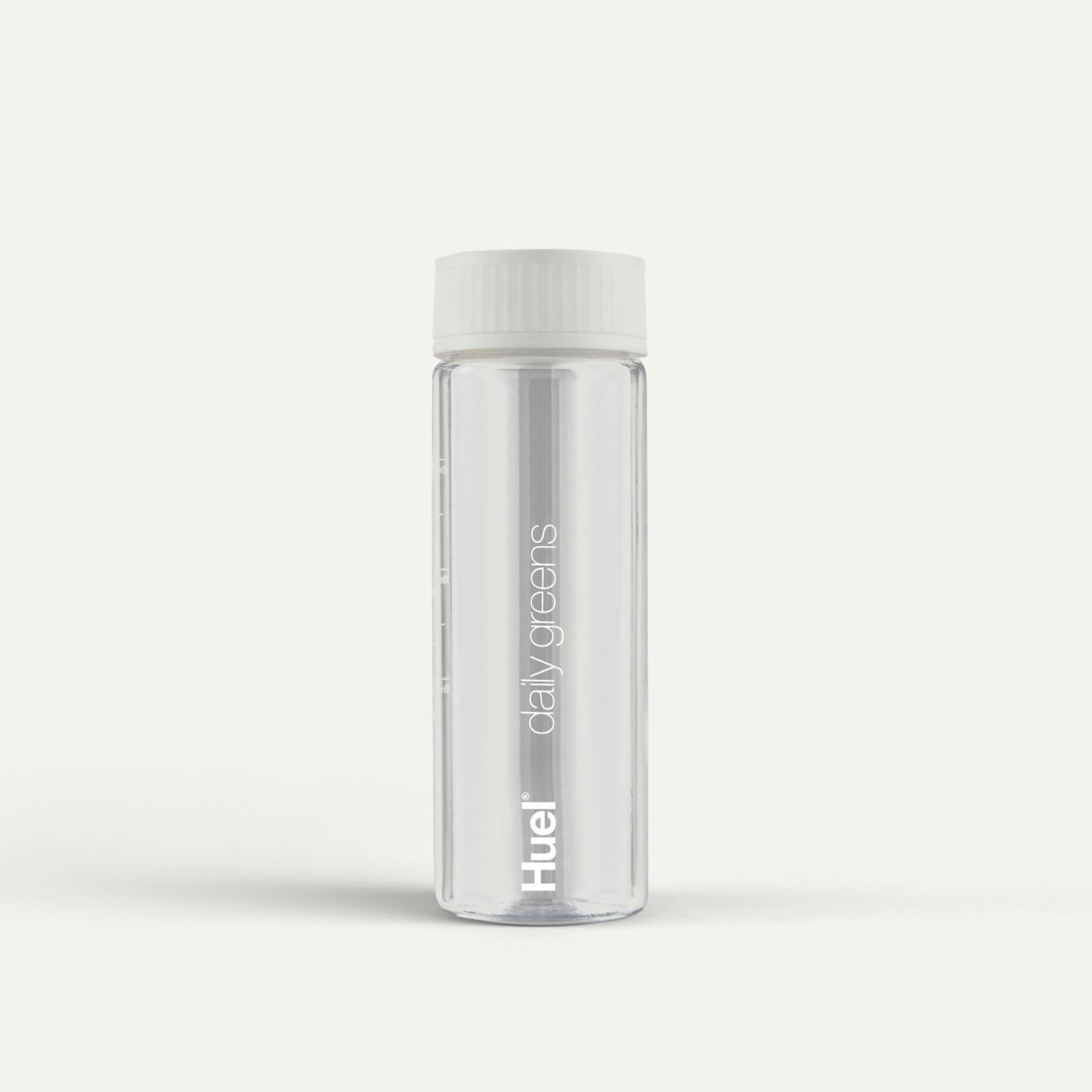 Clear Huel Daily Greens Bottle on a neutral colour background