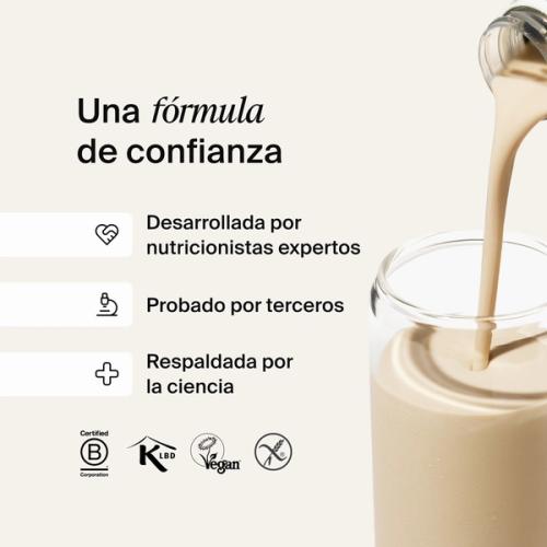 Huel RTD protein drink being poured into a glass