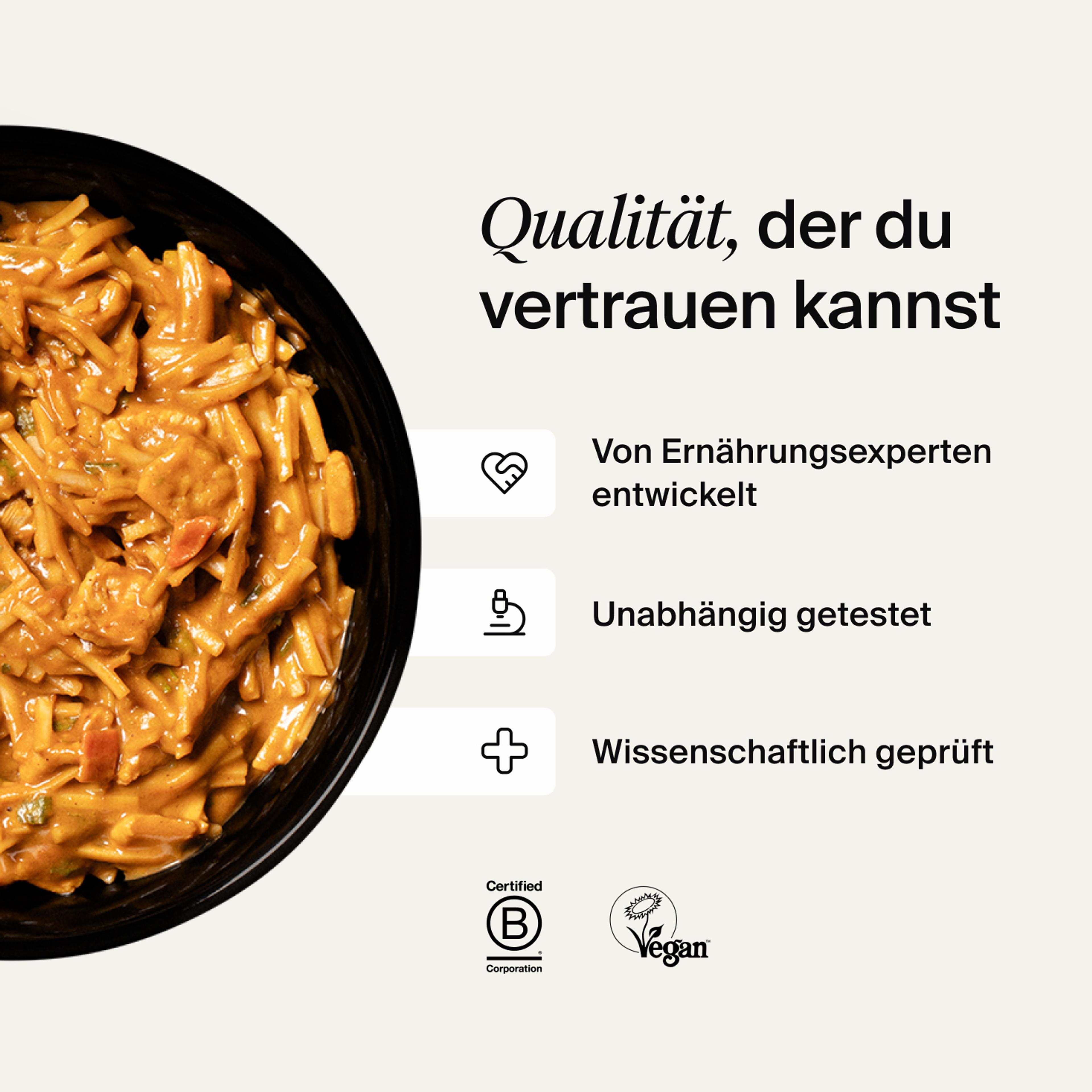 A bowl of Huel Hot & Savoury with fresh chilli and coriander on a neutral background