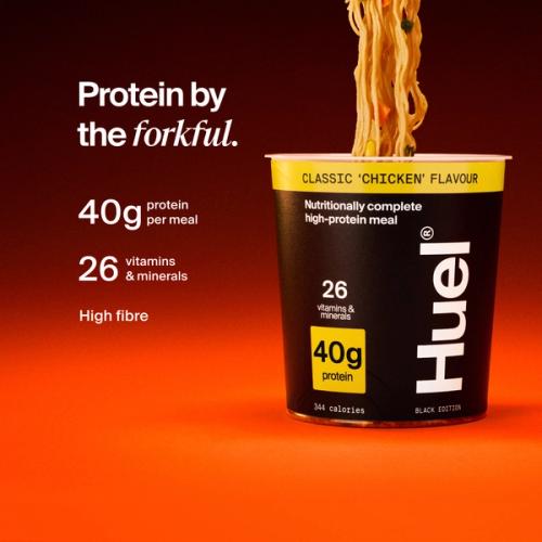 Huel Black Edition Noodles pot with noodles being lifted, alongside text highlighting 40g protein, 26 vitamins and minerals, and high fibre.
