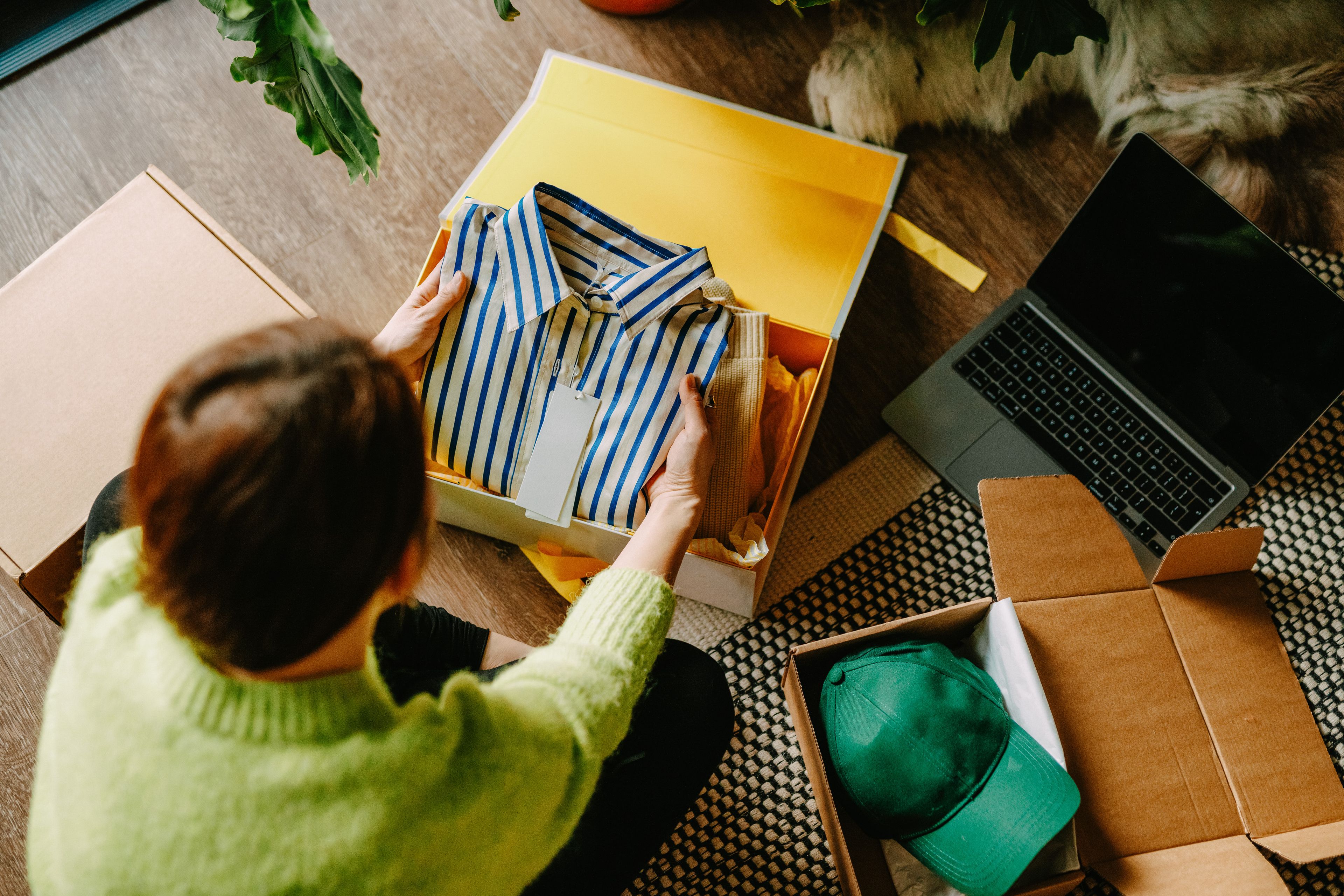 Woman unboxing clothing del