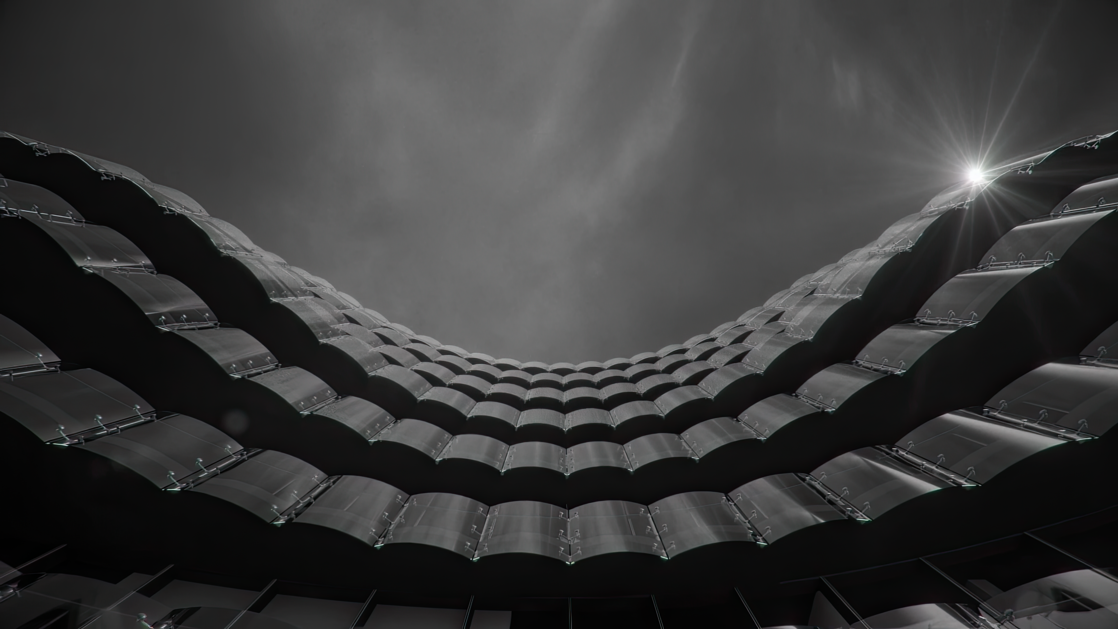 a bedroom with a bed , chair , mirror and large windows .