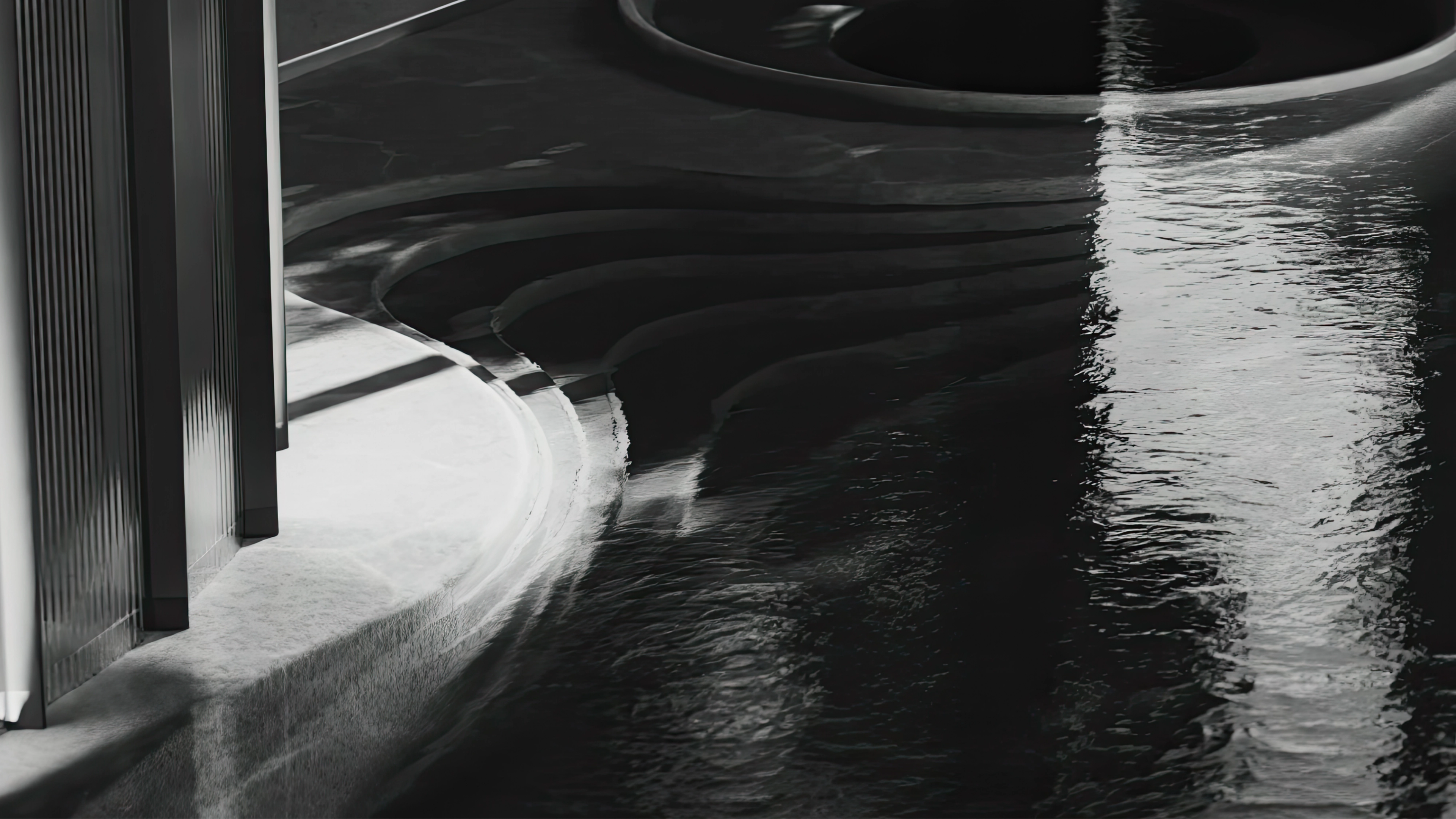 a bedroom with a bed , chair , mirror and large windows .