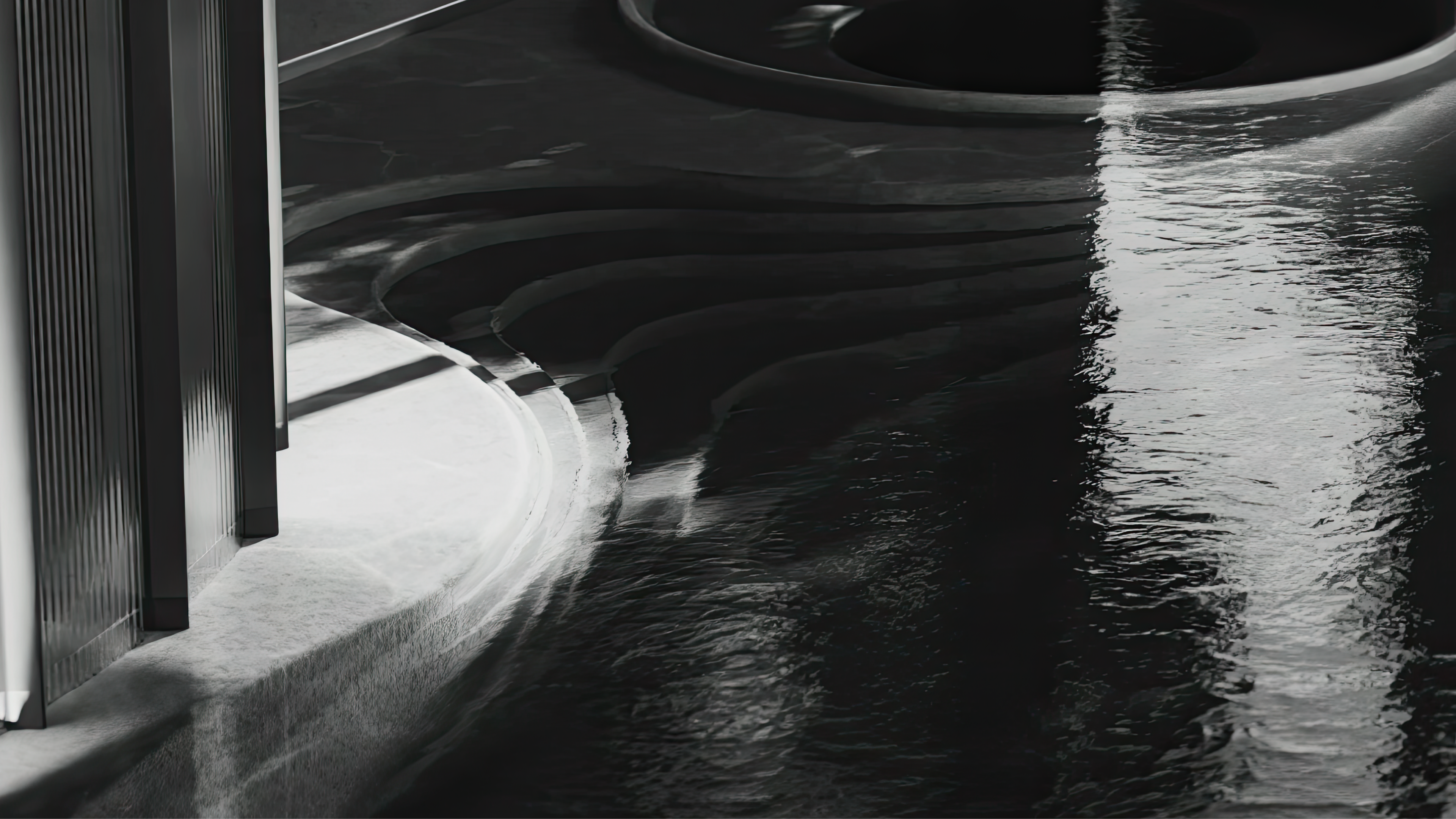 a bedroom with a bed , chair , mirror and large windows .