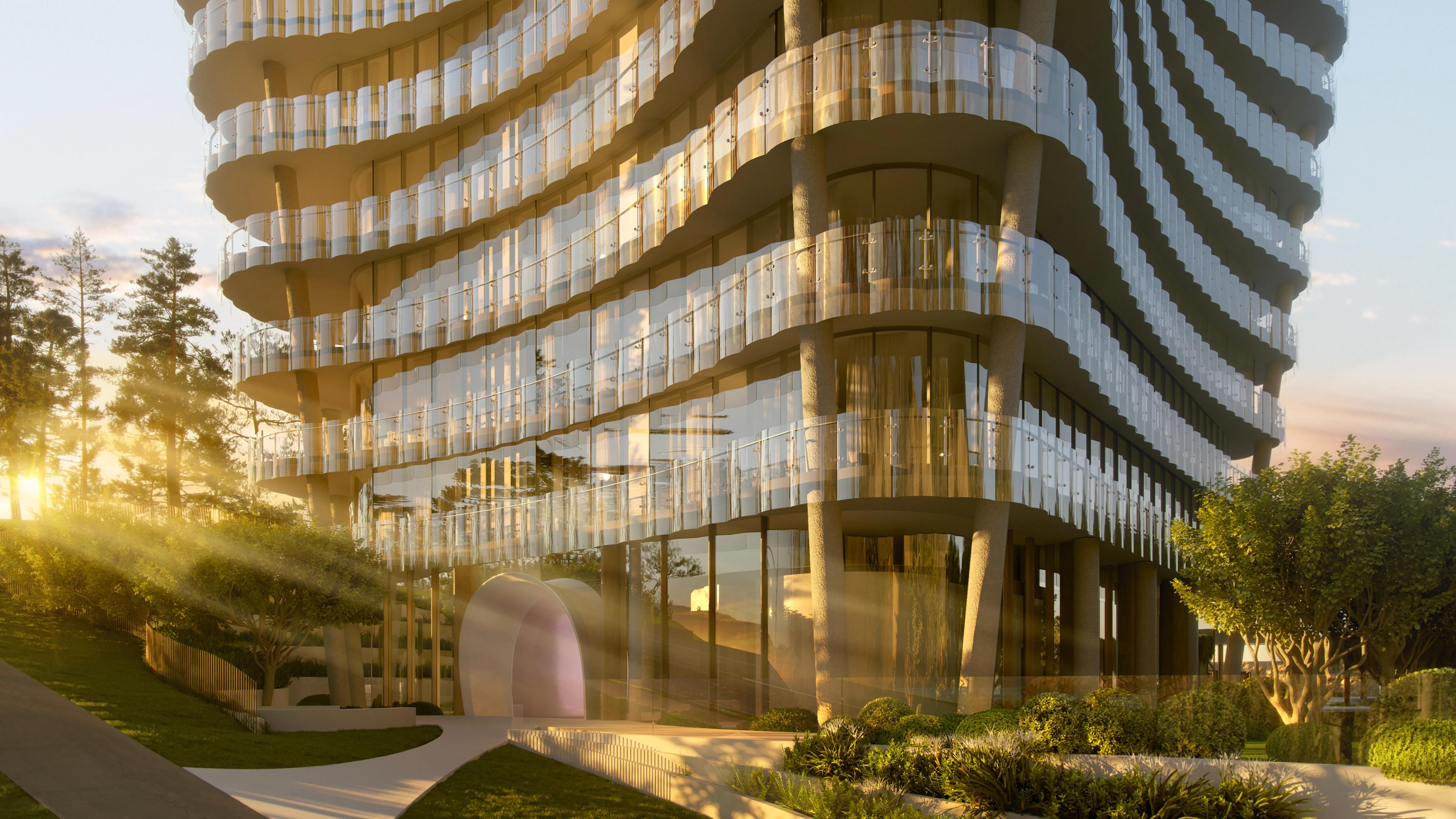 a tall building with a lot of windows is surrounded by trees .