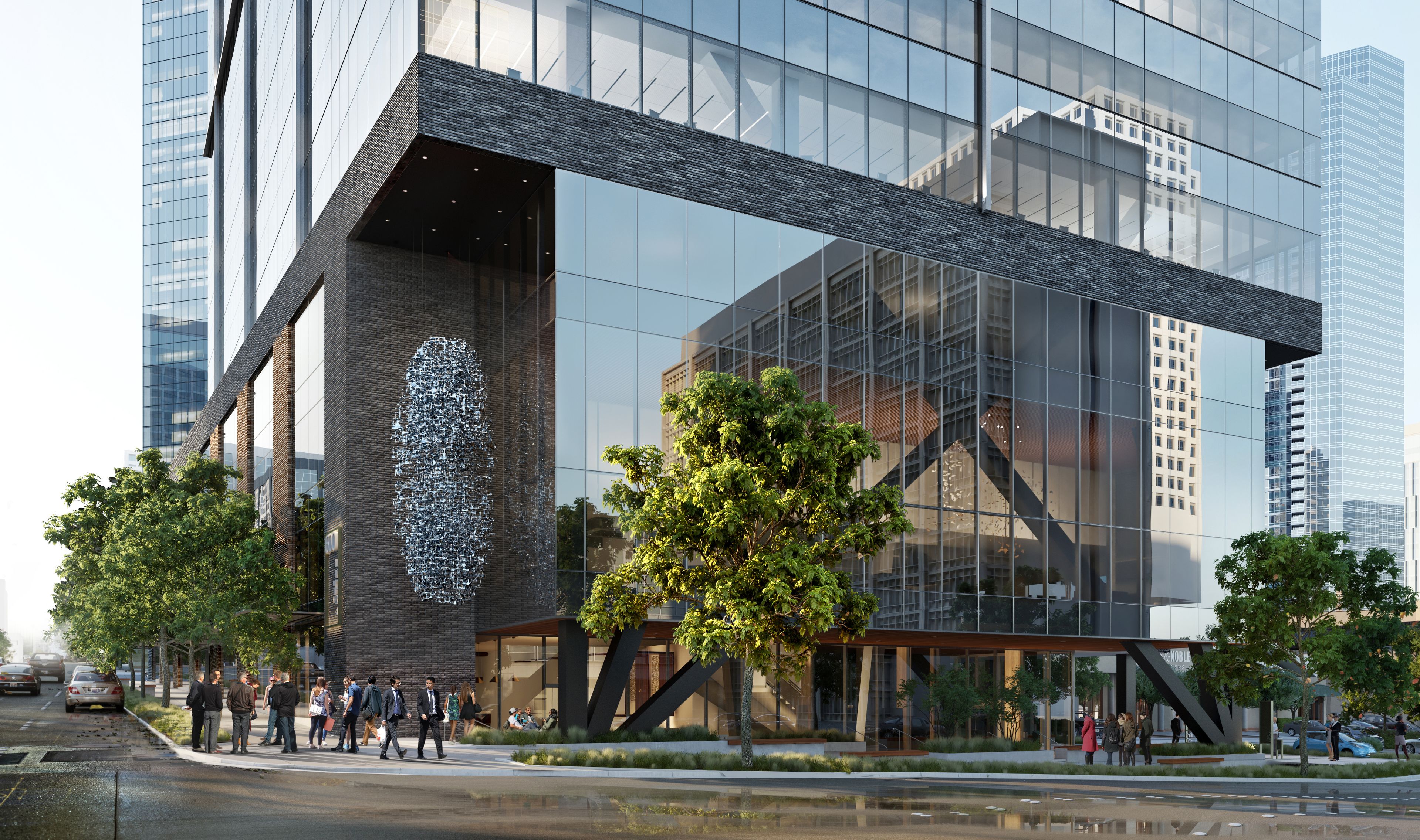 looking up at a tall building with a cloudy sky in the background .