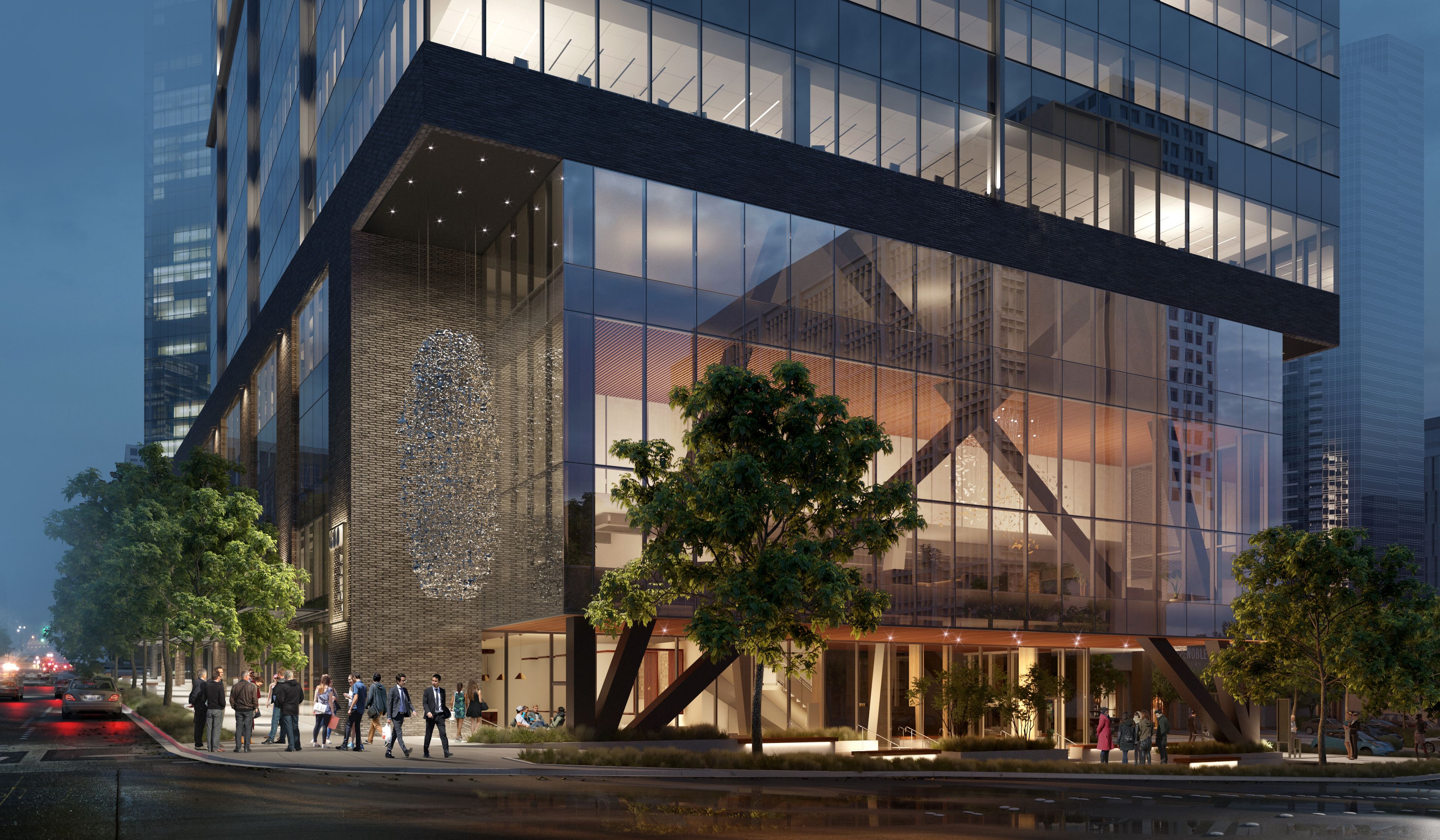 a tall building with a lot of windows is surrounded by trees .