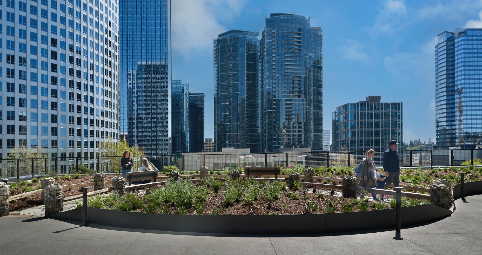 an artist 's impression of a city skyline with a river in the foreground .