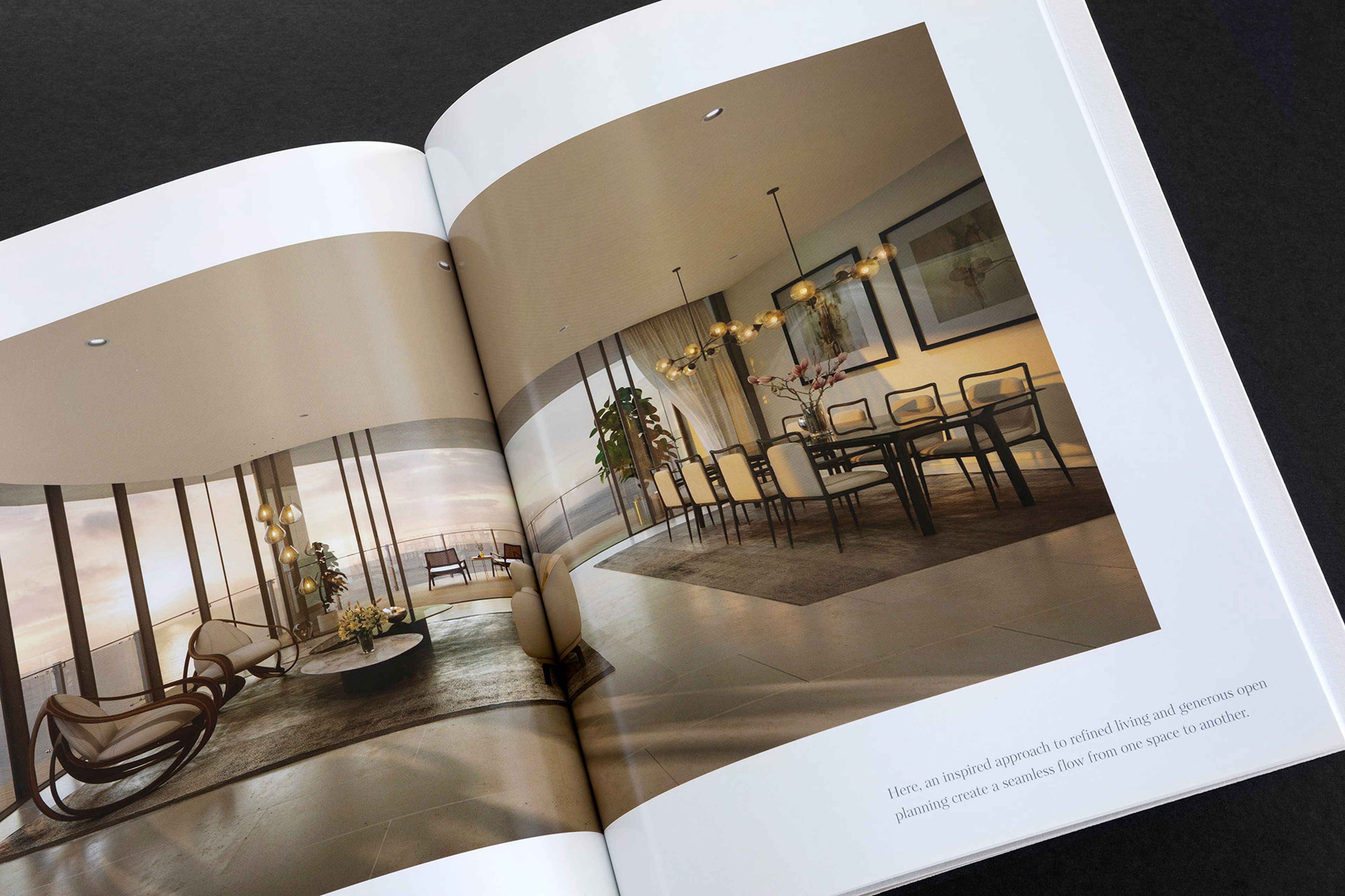 a brochure is open to a living room and dining room .