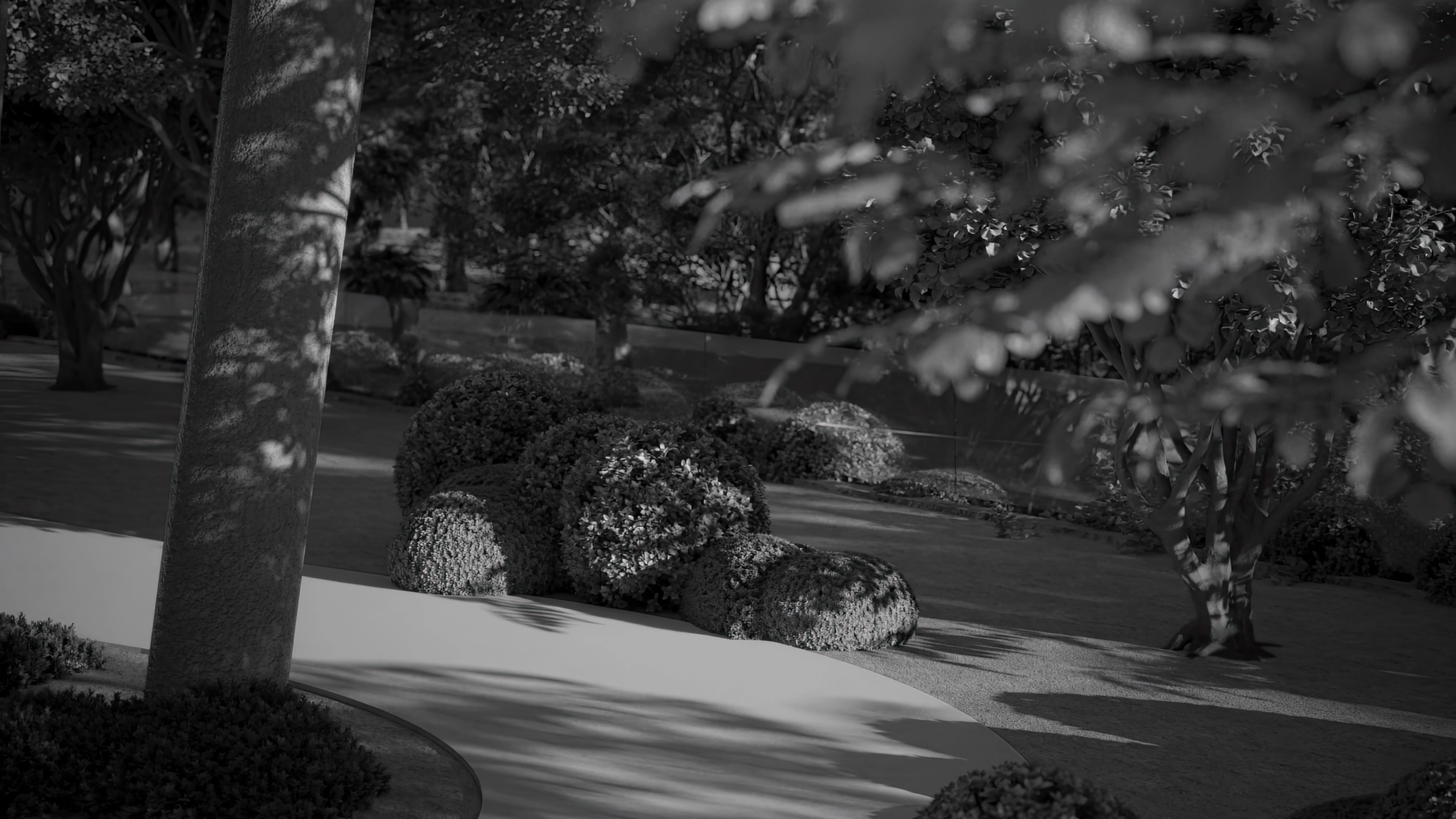 a kitchen with a black and white painting on the wall