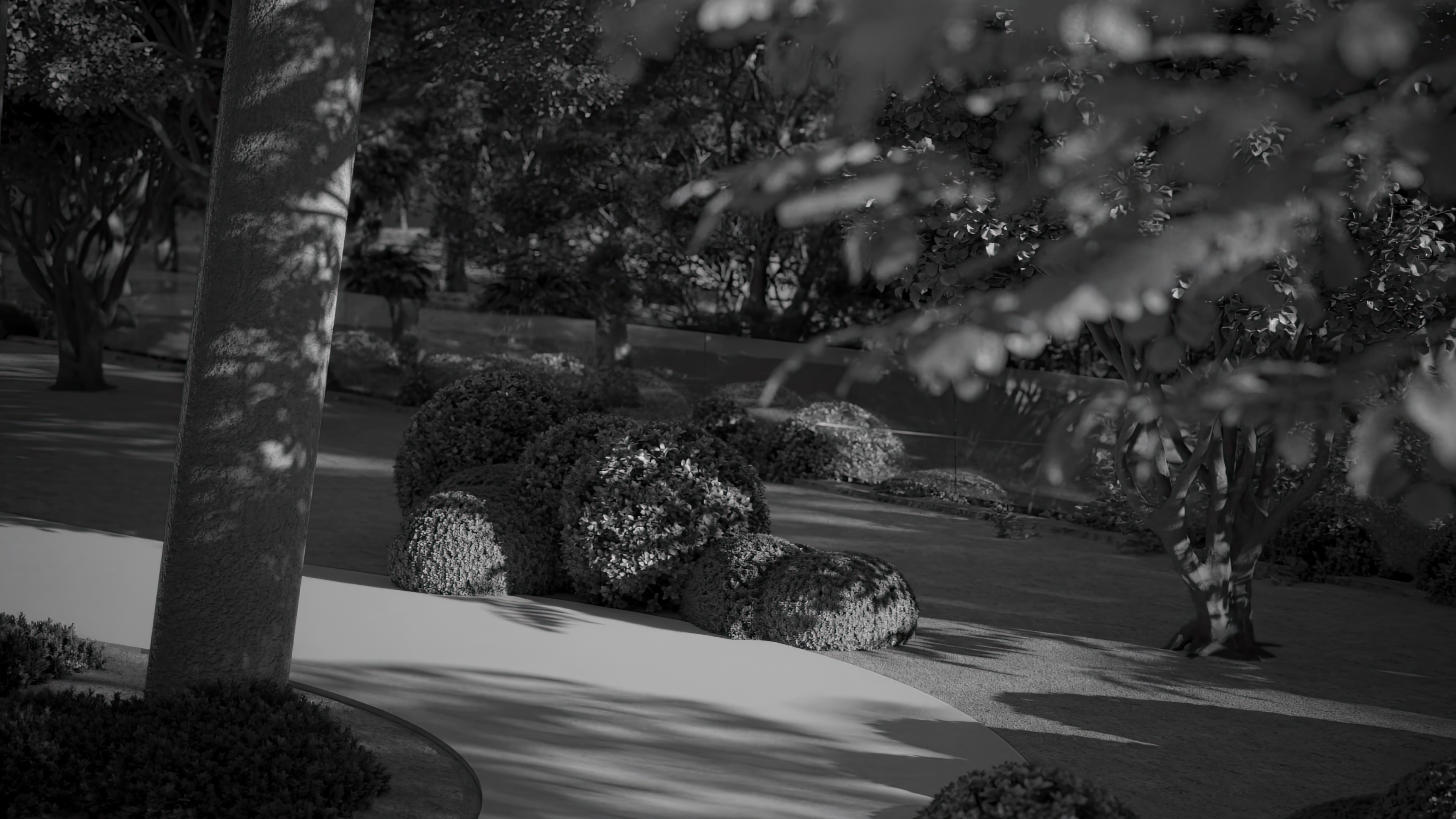 a kitchen with a black and white painting on the wall
