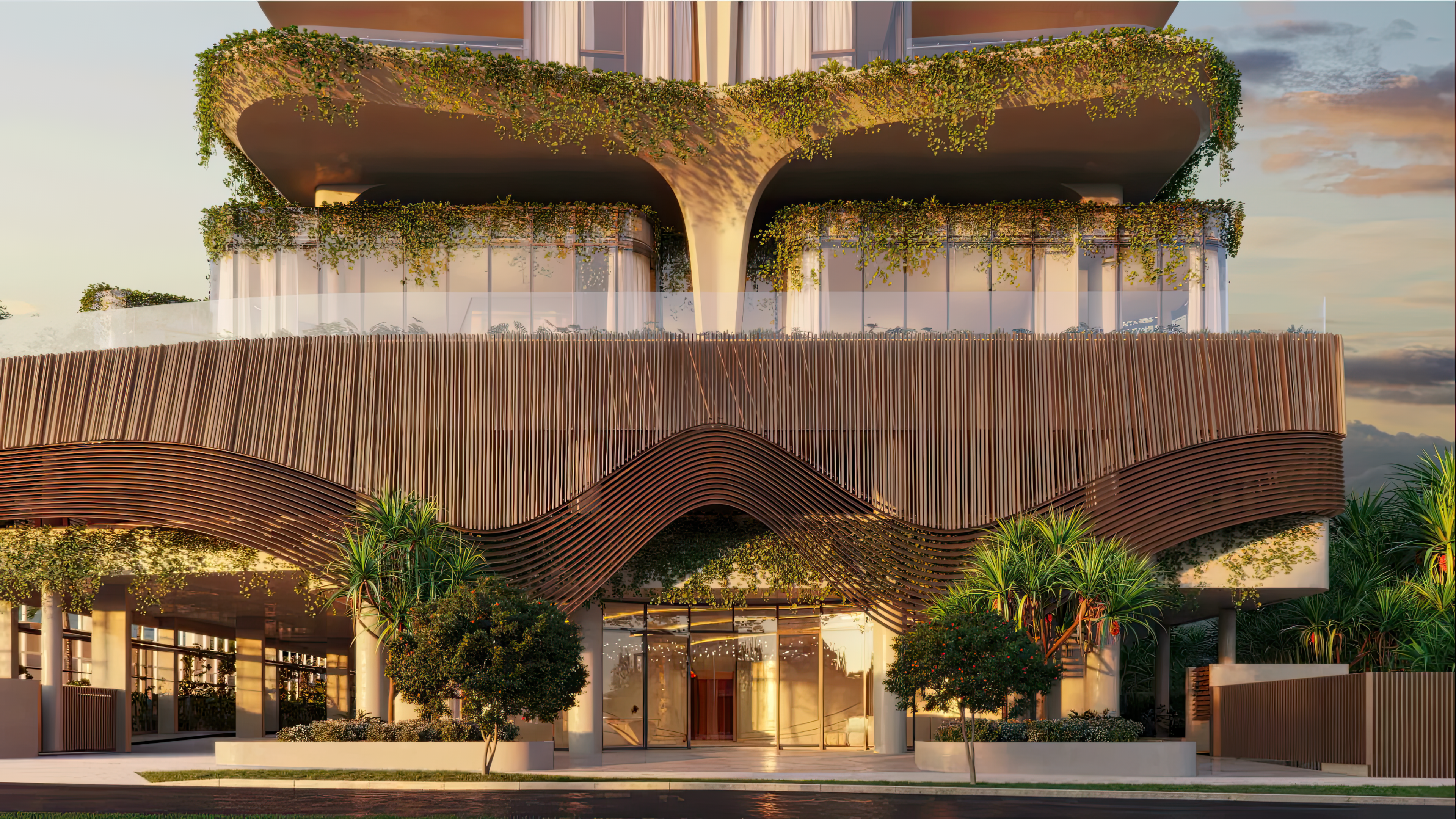 looking up at a tall building with a cloudy sky in the background .