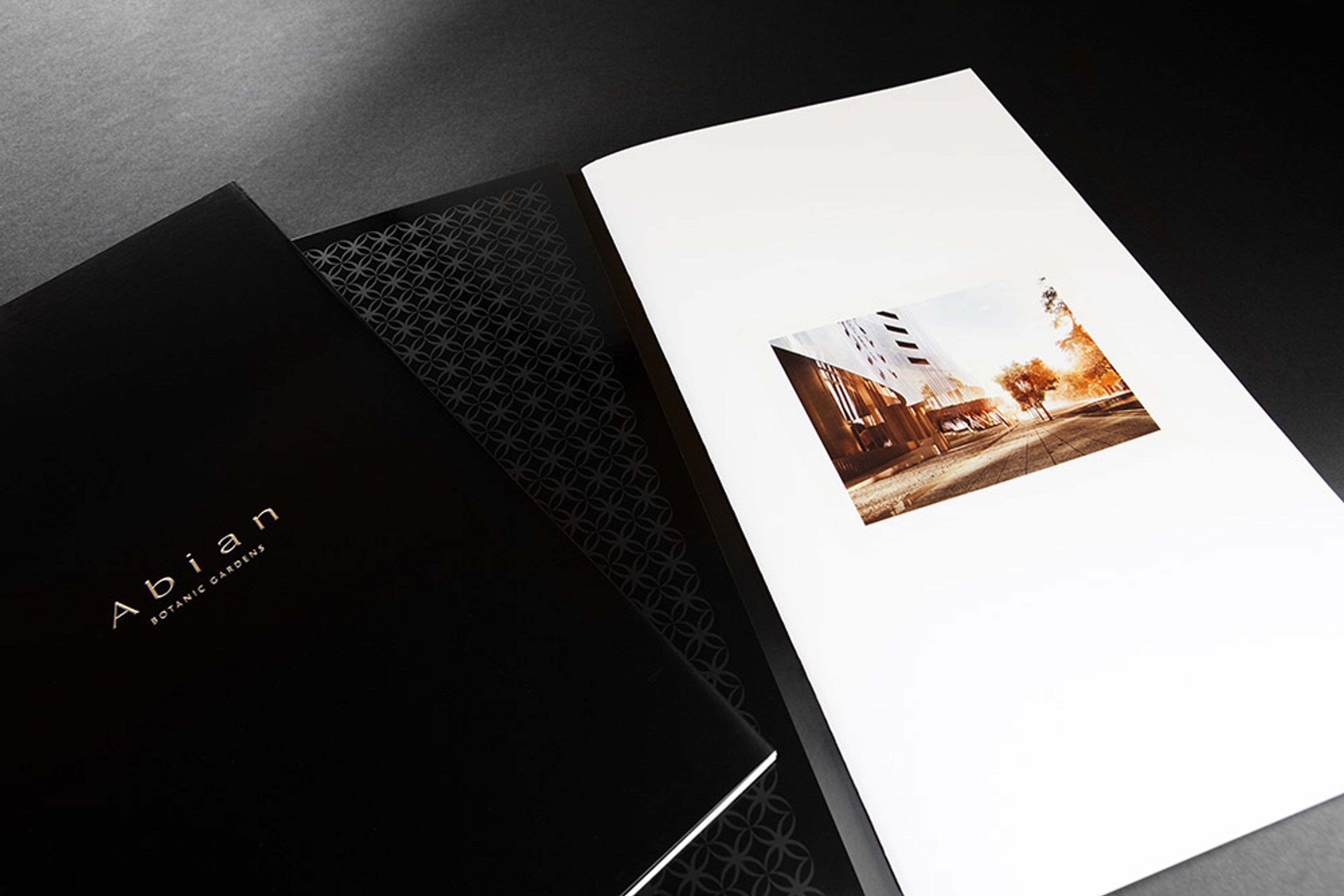 a black folder with a picture of a building on it .