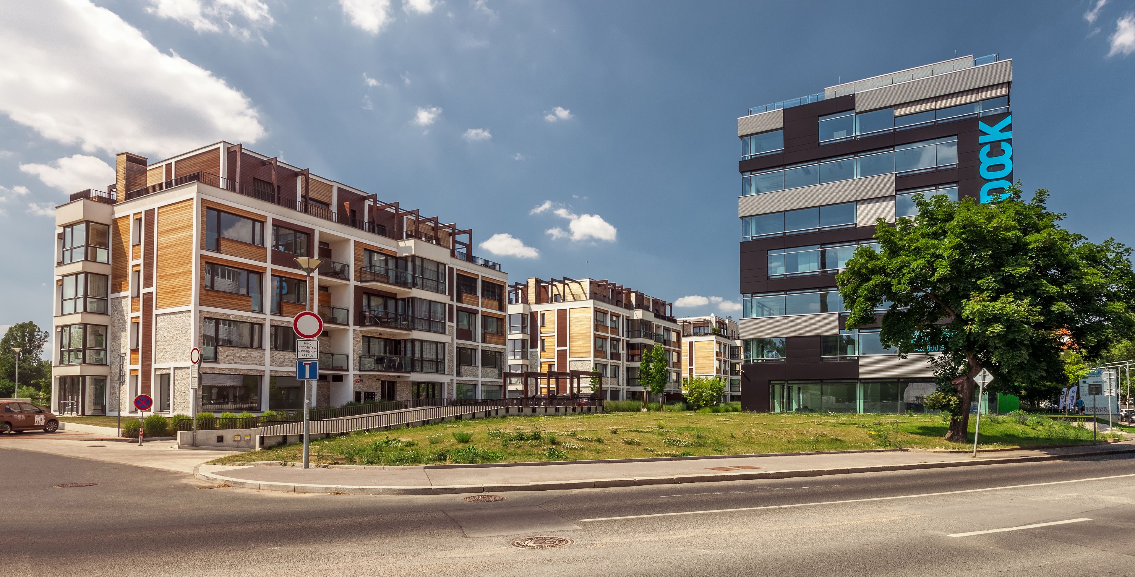 an artist 's impression of a city with a large arch in the middle of it .