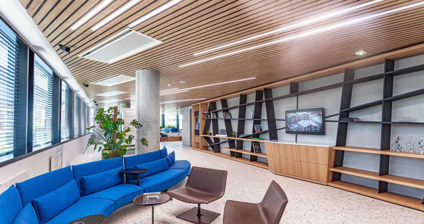 a large building with a glass roof and stairs