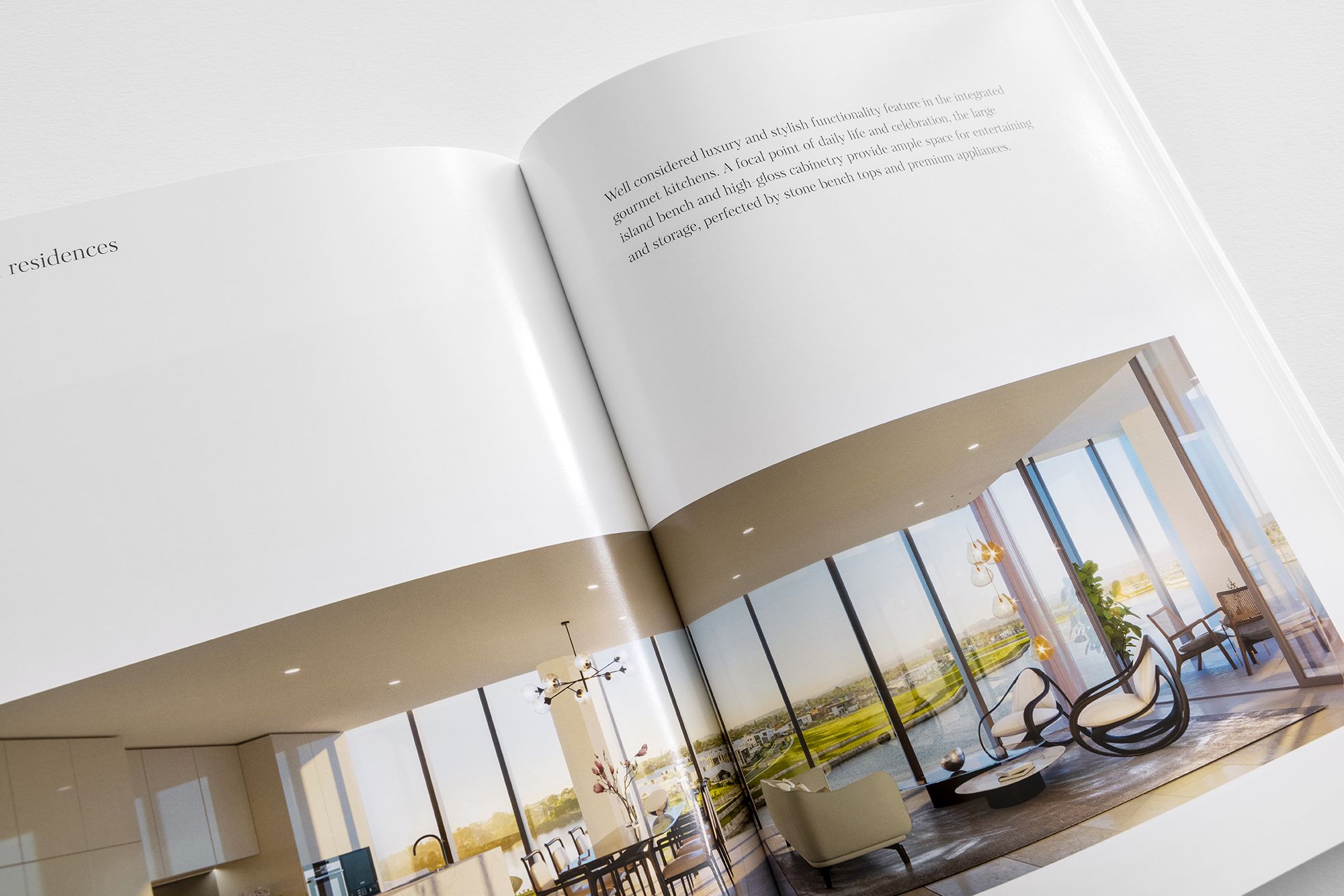 a brochure is open to a living room with a lot of windows .