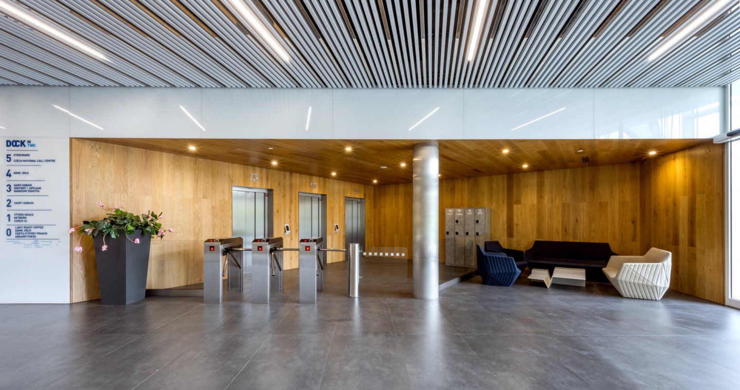 the inside of a large building with a glass ceiling and stairs .