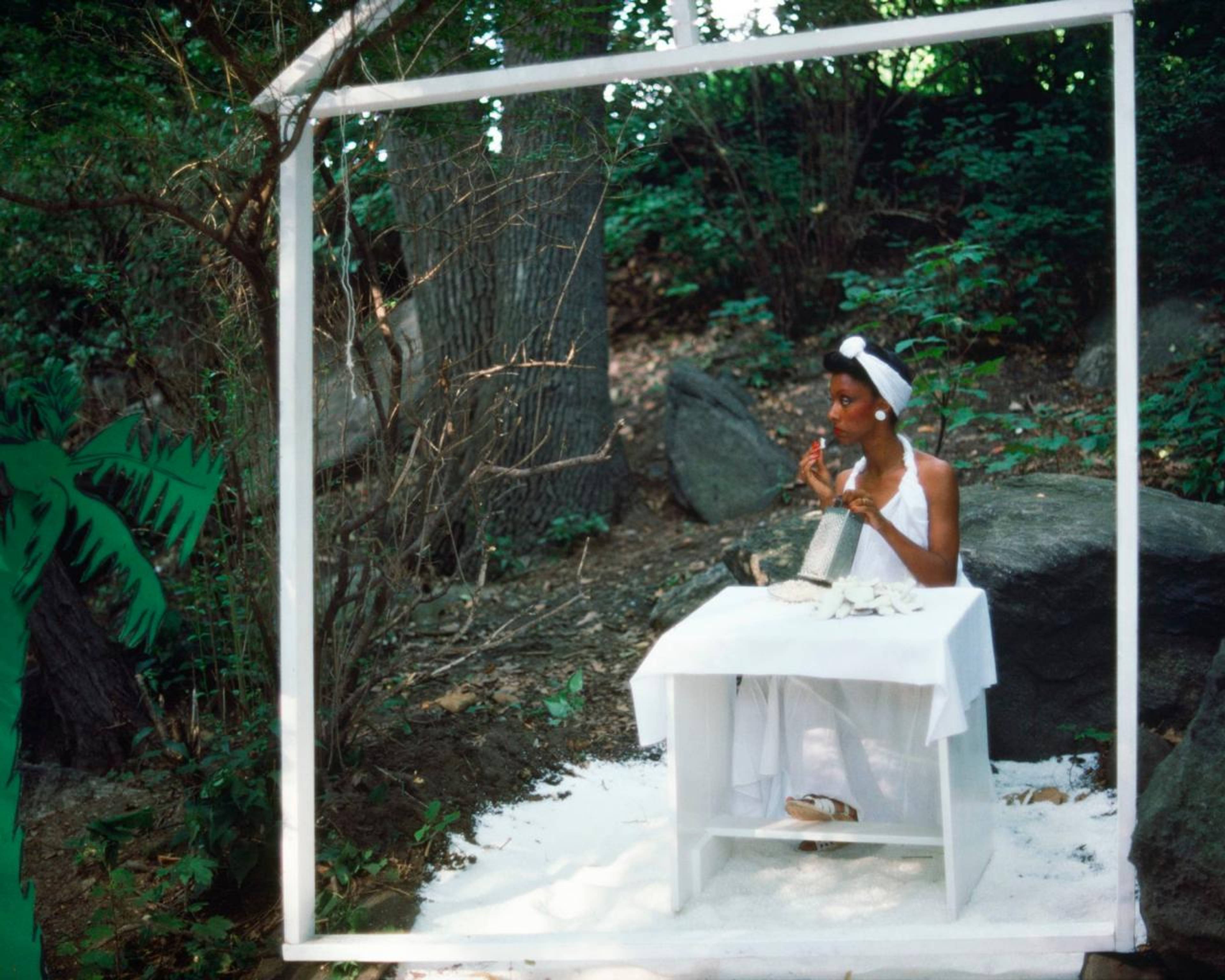 Lorraine O&#39;Grady, Rivers, First Draft: The Woman in White eats coconut and looks away from the action , 1982/2015, digital chromogenic print from Kodachrome 35mm slides in 48 parts, 40 &times; 50 cm. Edition of 8 + 2 AP. Courtesy Alexander Gray Associates, New York. &copy; Lorraine O&rsquo;Grady/Artists Rights Society (ARS), New York