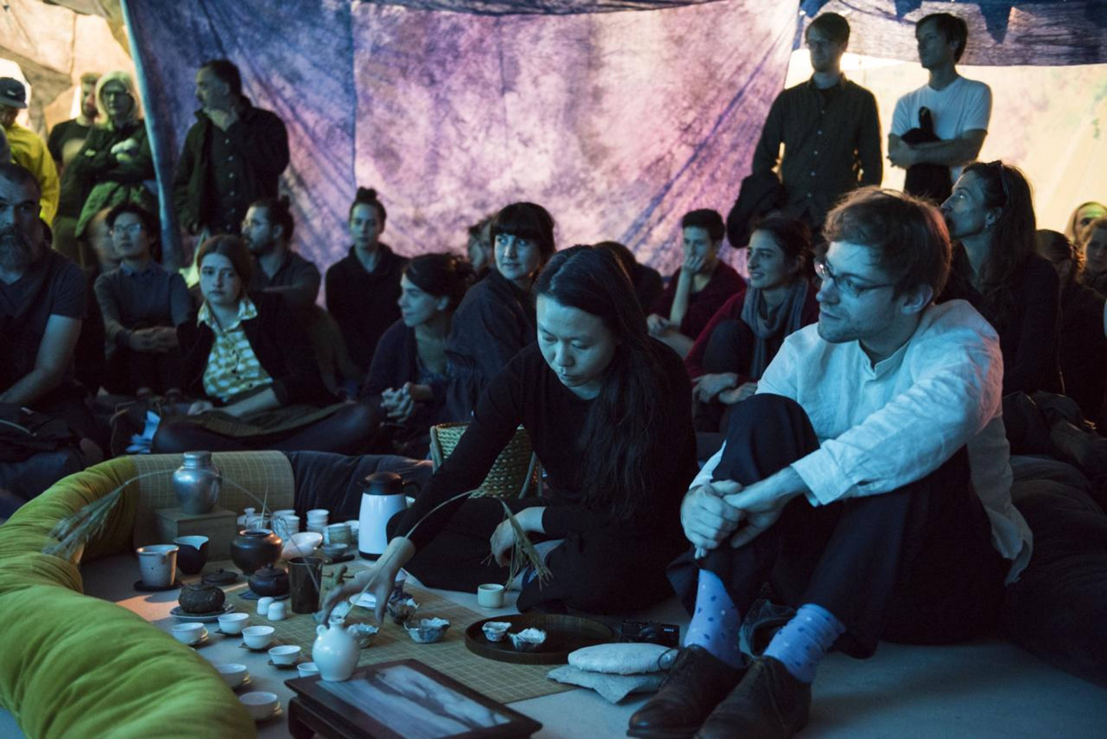 Ying Le and Paul Sochacki serving tea inside Reto Pulver&#39;s installation Dehydrated Landscape of a Condition (2007&ndash;2015) at Haus Der Kulturen der Welt, 2015 &copy; Sebastian Bolesch for HKW