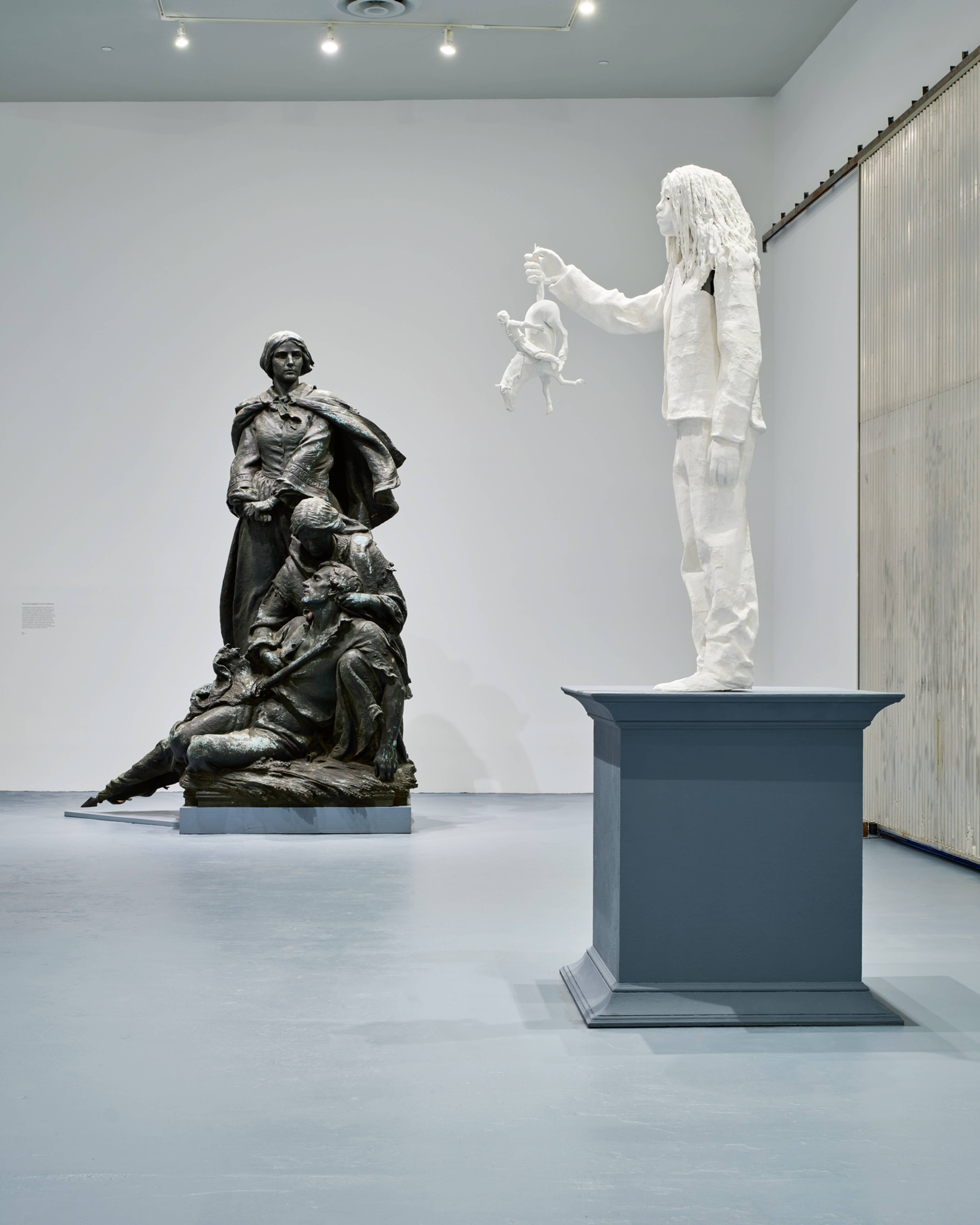 Right: Karon Davis, Descendant, 2025; behind: J. Maxwell Miller, Confederate Women of Maryland, 1917