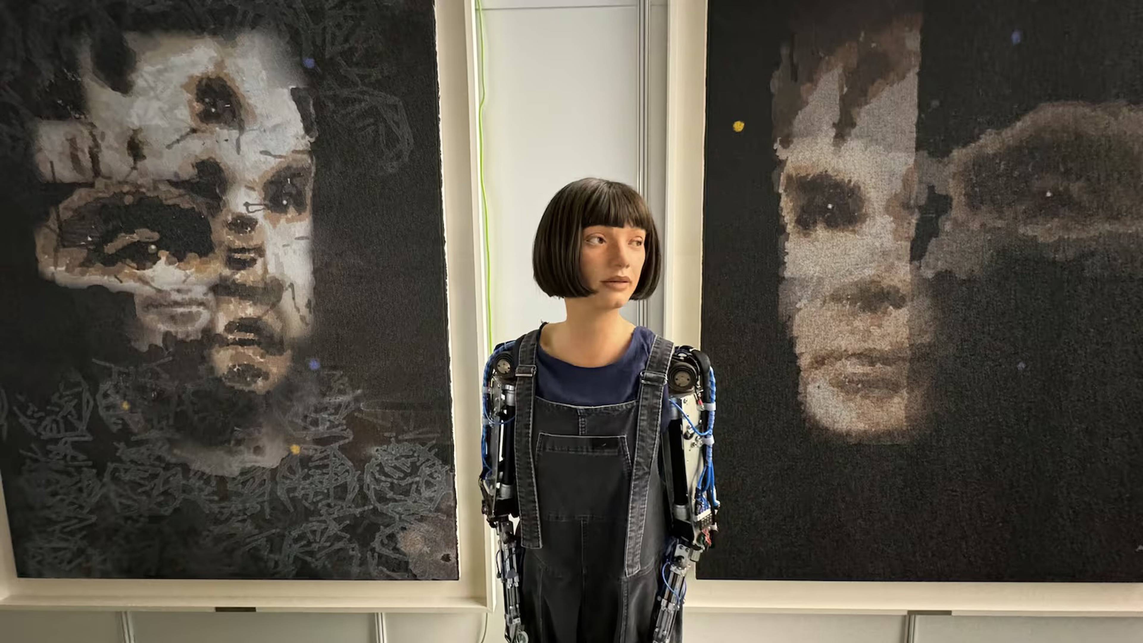 Humanoid artist robot Ai-Da with Portrait of Alan Turing, 2024