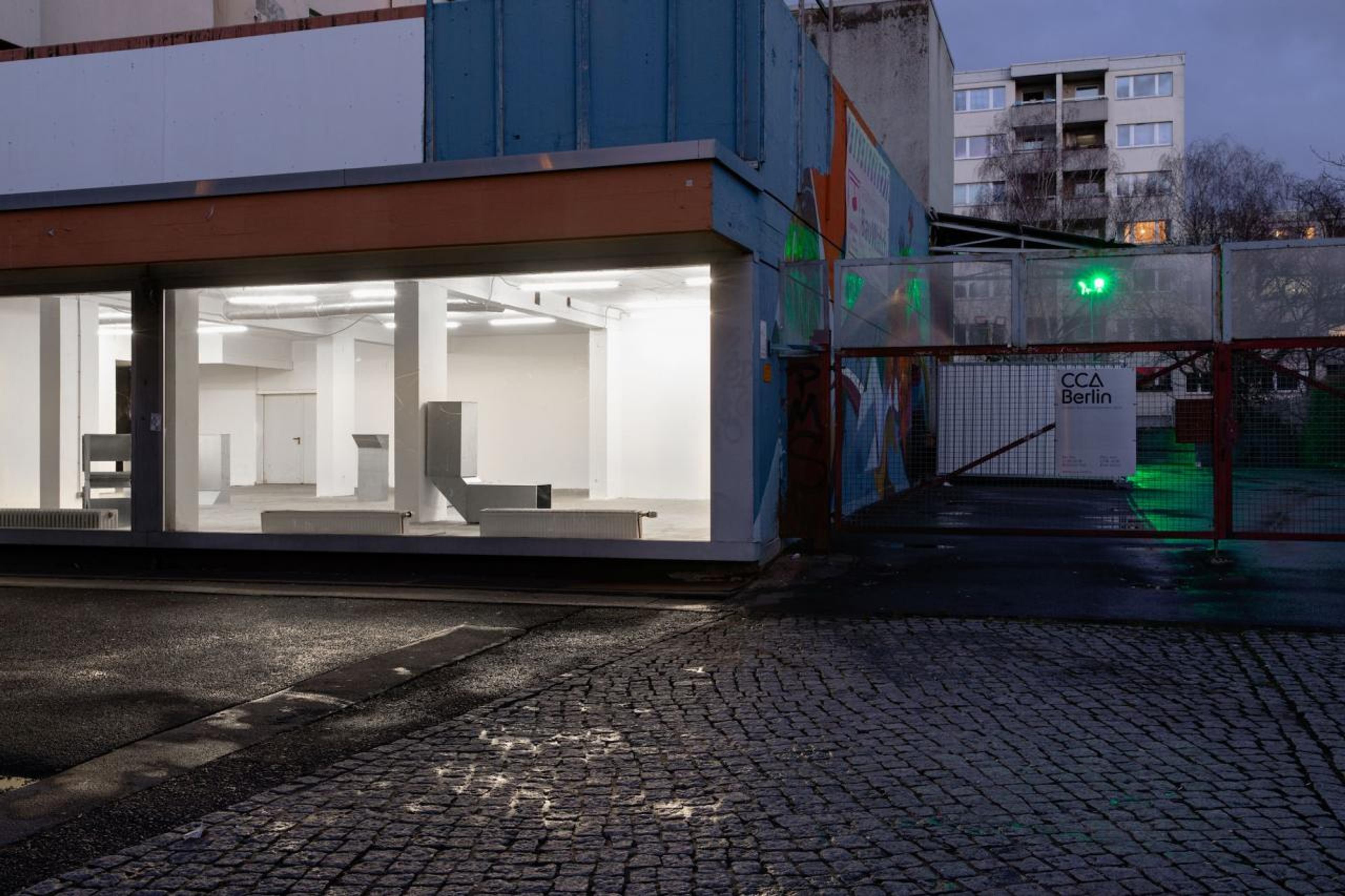 Exterior of CCA Berlin. Inside: installation view of Charlotte Posenenske,  ​&ldquo; Vierkantrohre Serie D&rdquo;