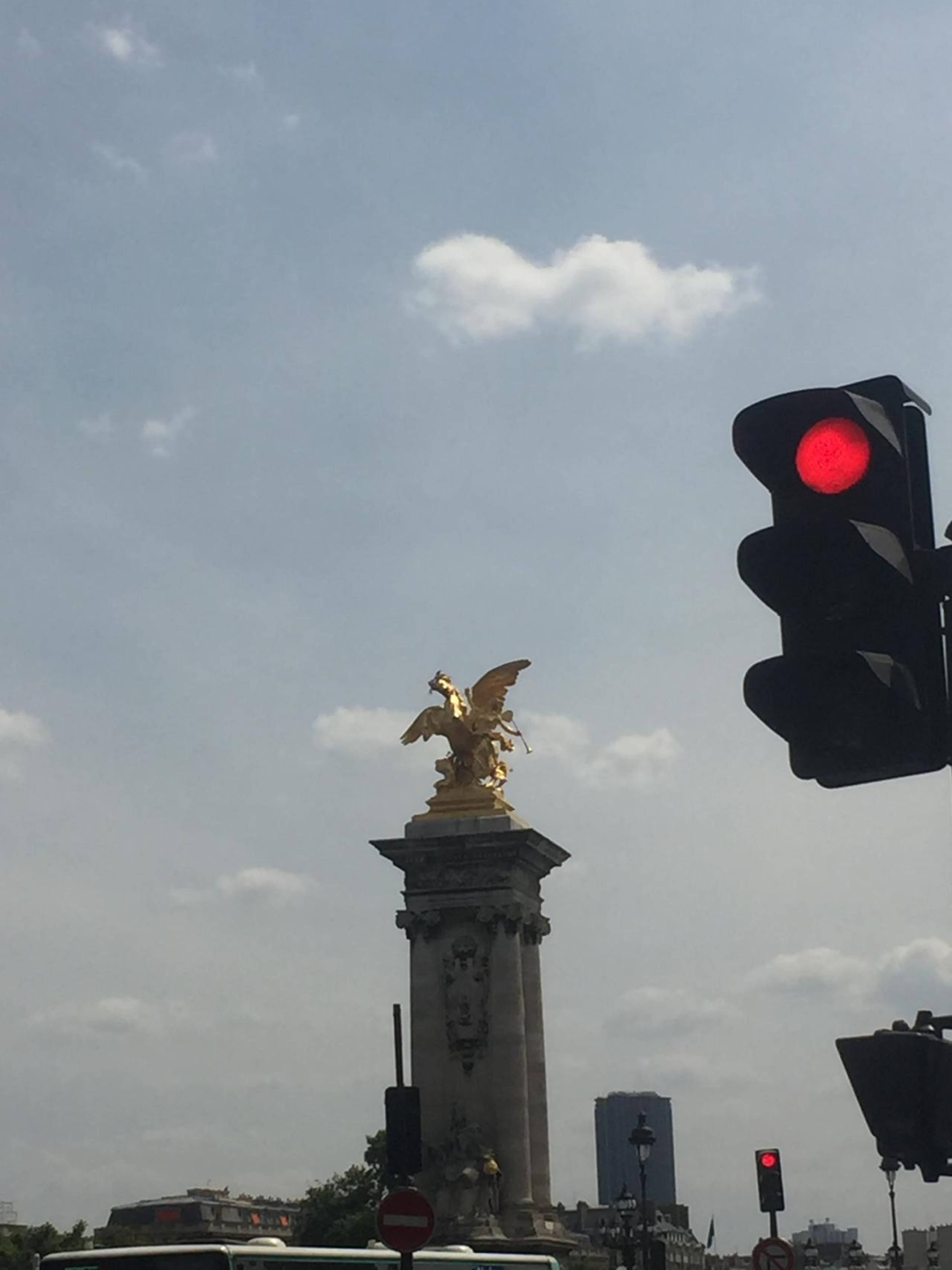 One of the Pont Alexandre III&rsquo;&rsquo;s &lsquo;fames&rsquo; or rumours. In Greco-Roman mythology Pheme or Fama was a gossip with &ldquo;her feet on the ground, and her head in the clouds, making the small seem great and the great seem greater&rdquo; and lived in a home with 1000 windows so she could hear all being said in the world &ndash; at least according to her acolyte Virgil