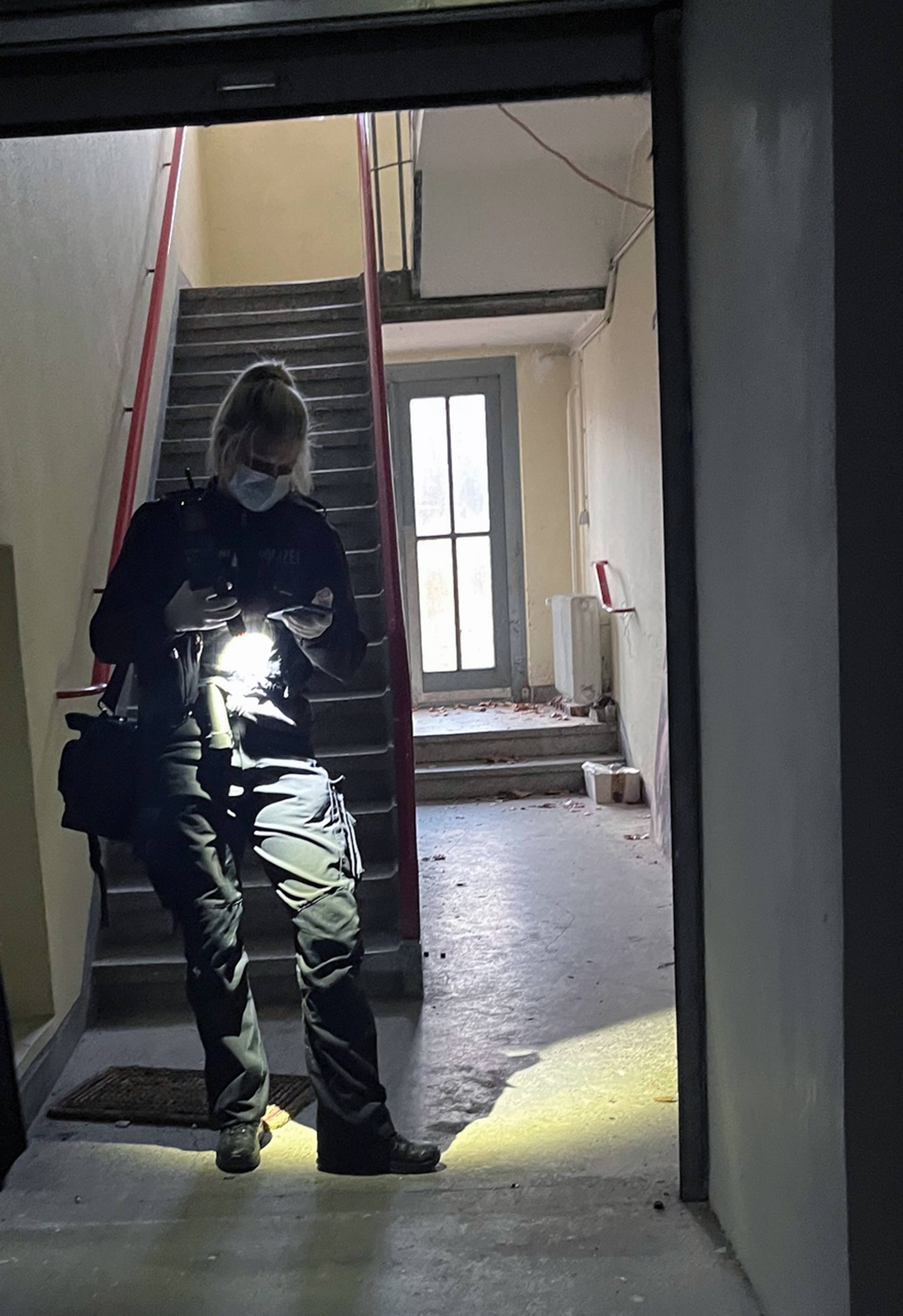 A police officer at artist Julia Scher’s studio, Cologne