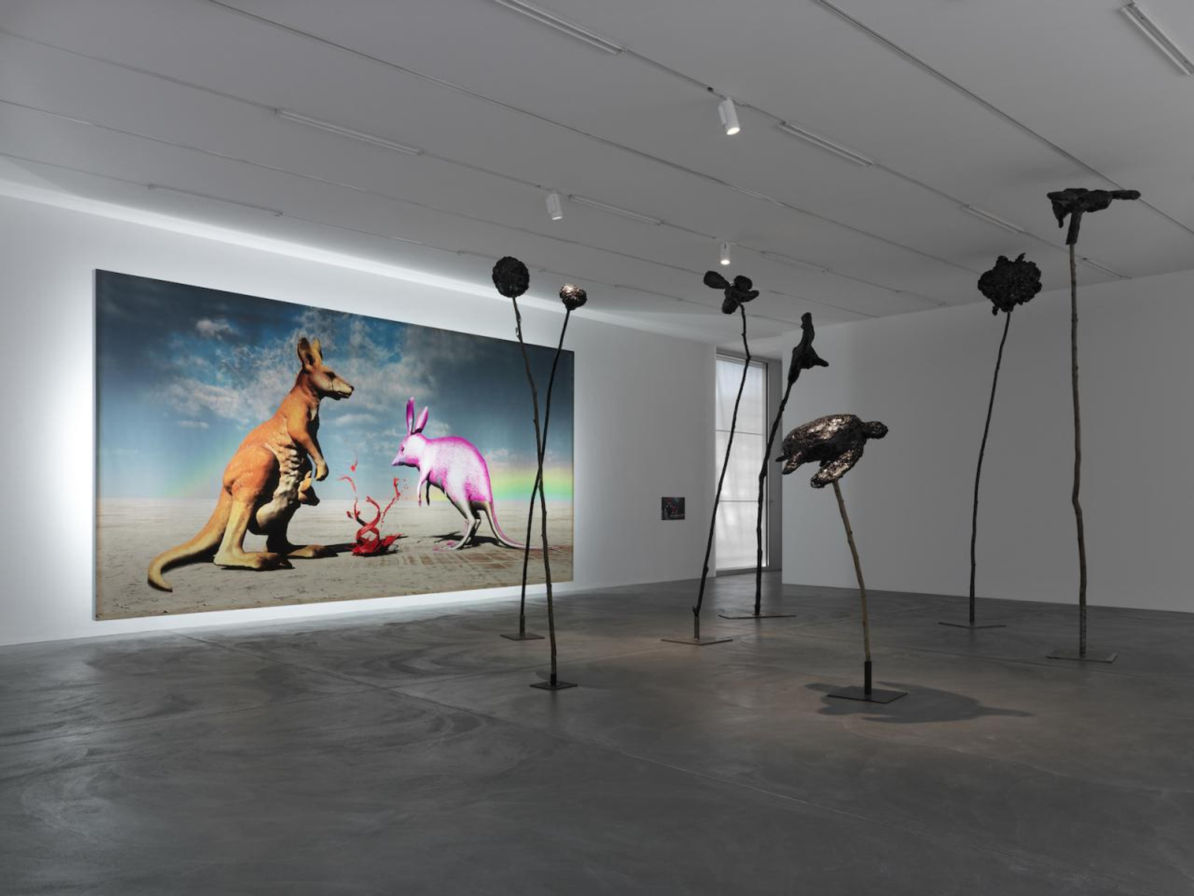 View of &ldquo;DOGGO&rdquo; Background: Judgement. The kangaroo is not happy. it&rsquo;s not clear who or what it represents but it&rsquo;s not in a good place  (2014) Backlit digital print on vinyl, 400 x 786 cm Photo: Annik Wetter