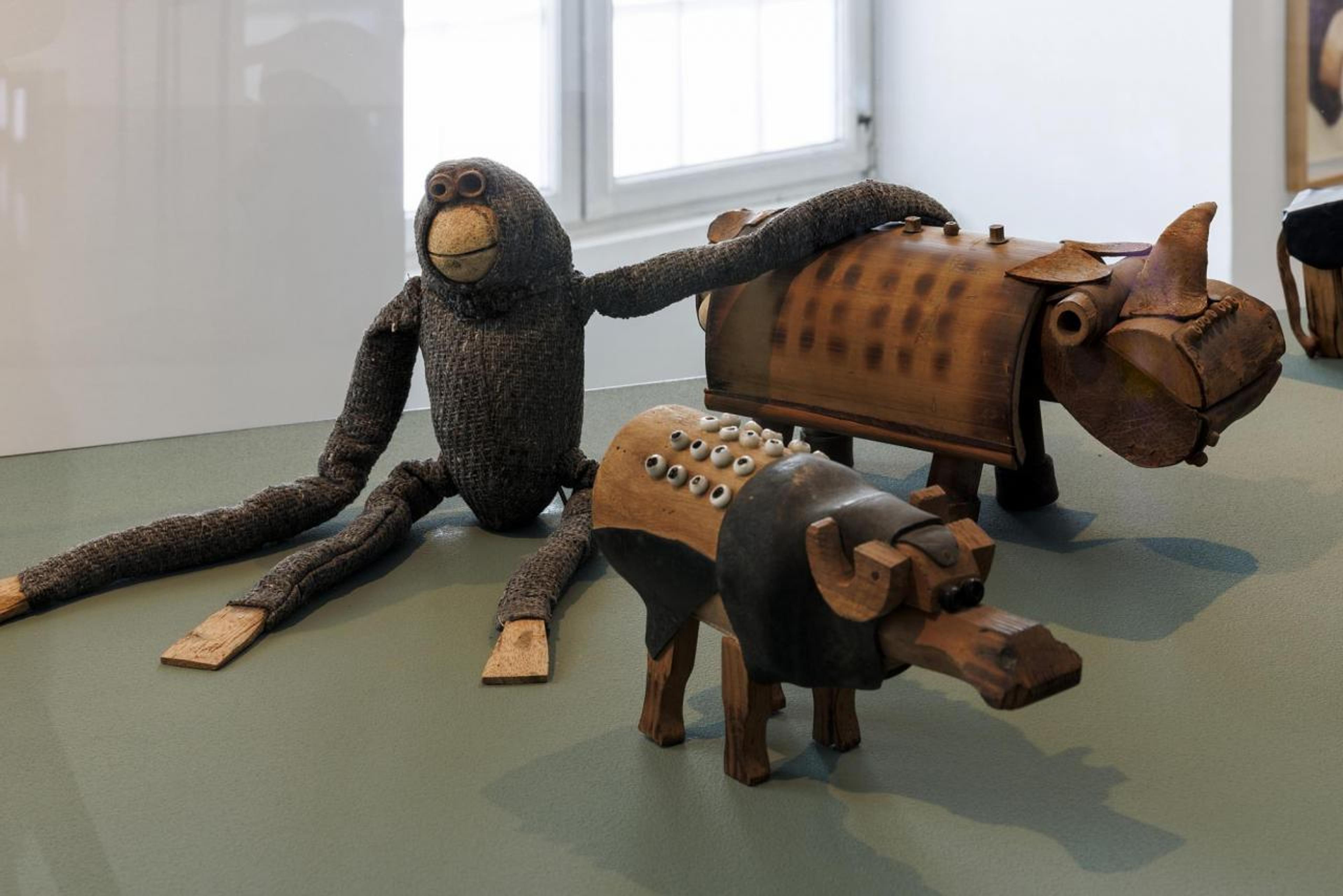 Asia Art Archive and K.G. Subramanyan, Buffalo and Rhino (ca. 1960-1980); Feroze Katpitia, Monkey (ca. 1960-1980); toys designed for the Fine Arts Fair. Installation view, Fridericianum, 2022, Kassel. Photo: Frank Sperling