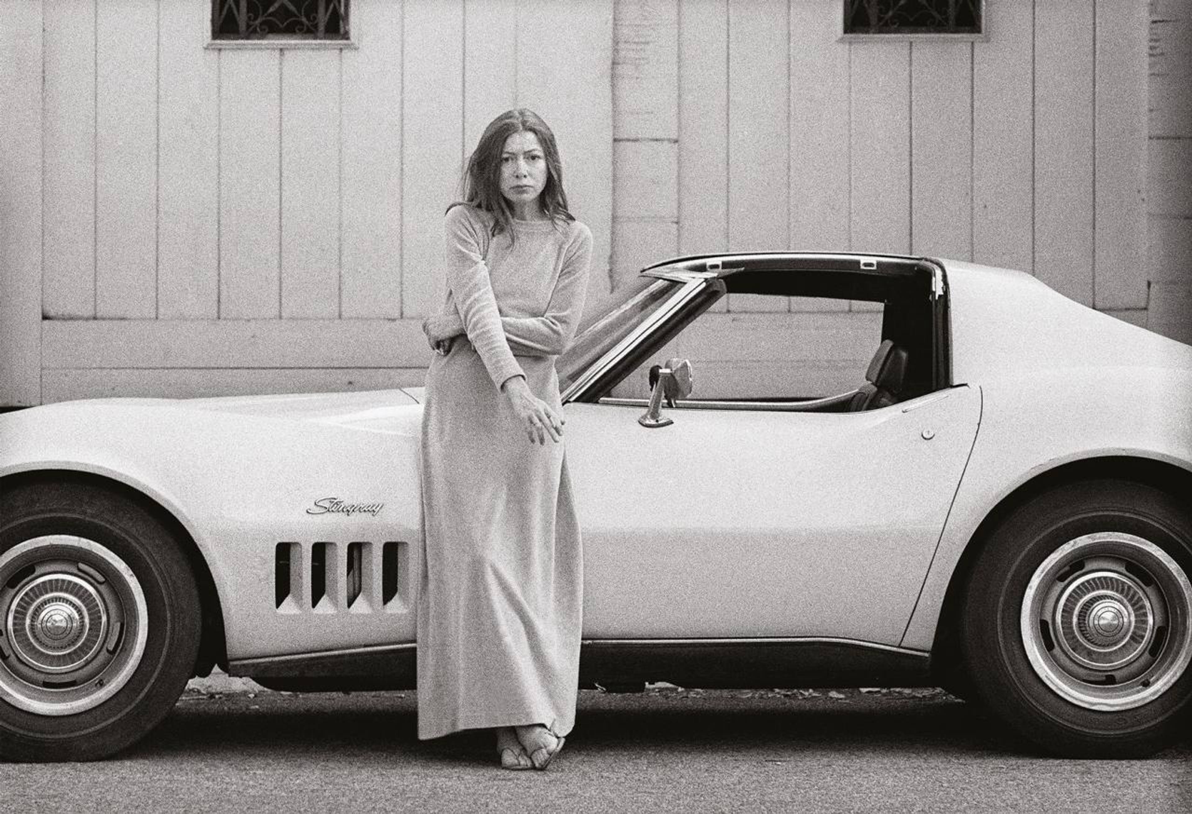 Joan Didion in front of her Stingray Corvette, 1968. Photo: Julian Wasser