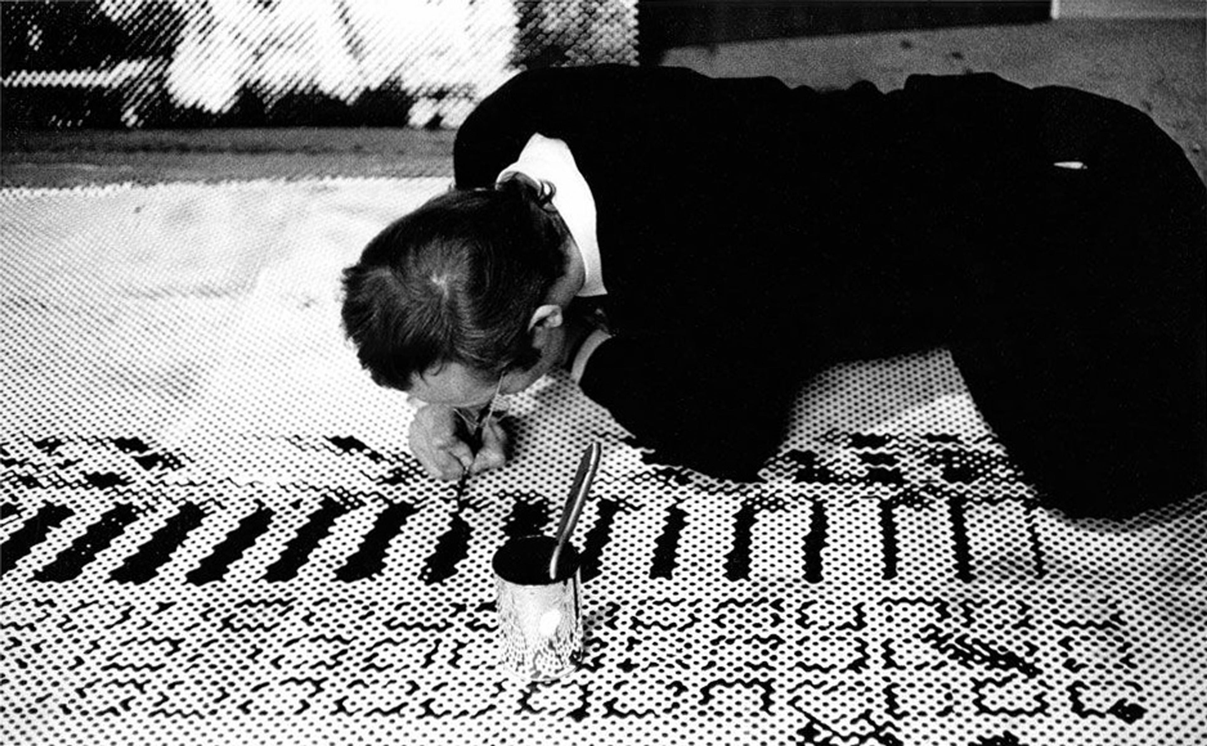 Sigmar Polke working in his studio on Front of the Housing Block (Häuserfront), 1967