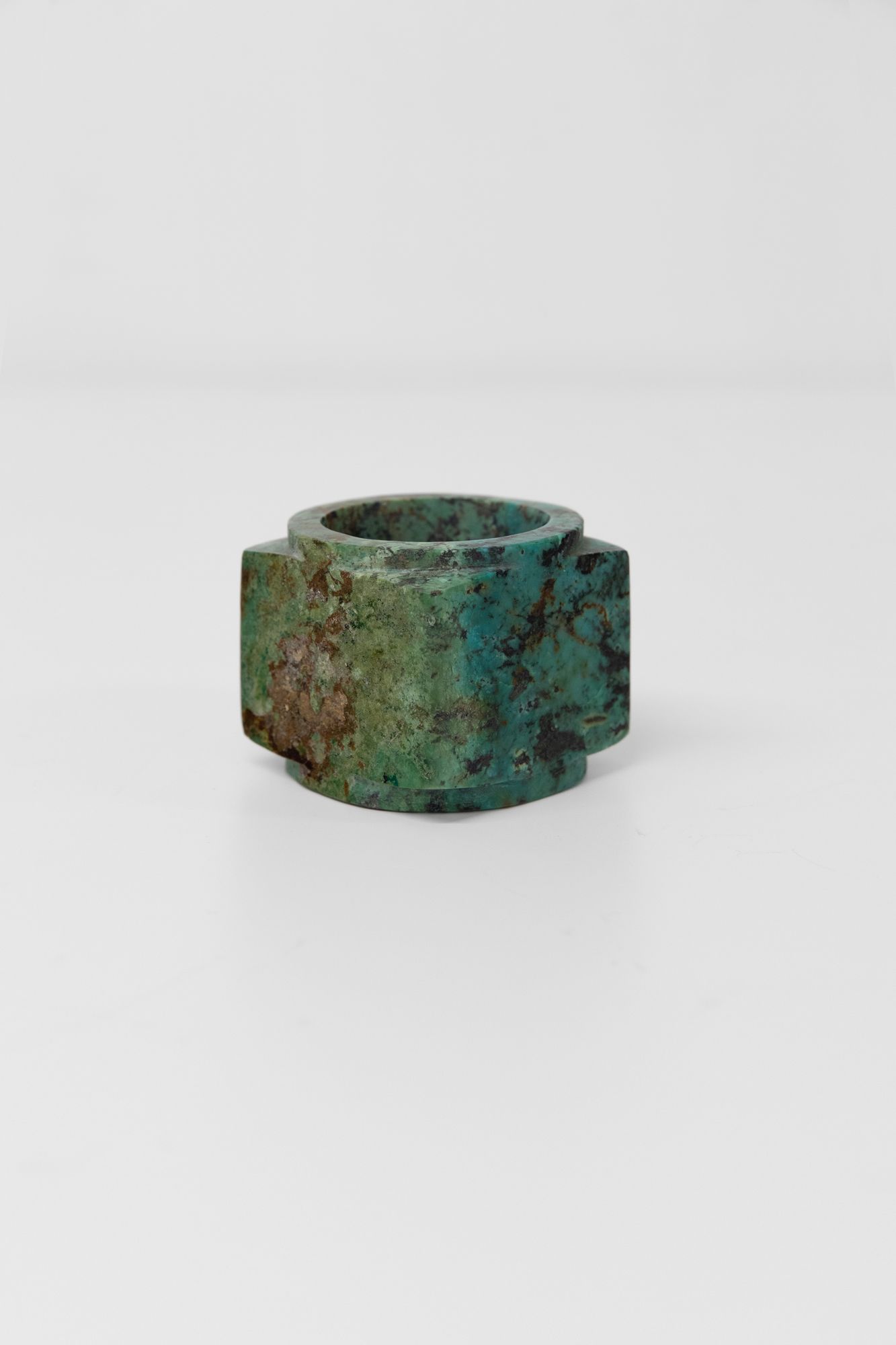 A carved turquoise cong