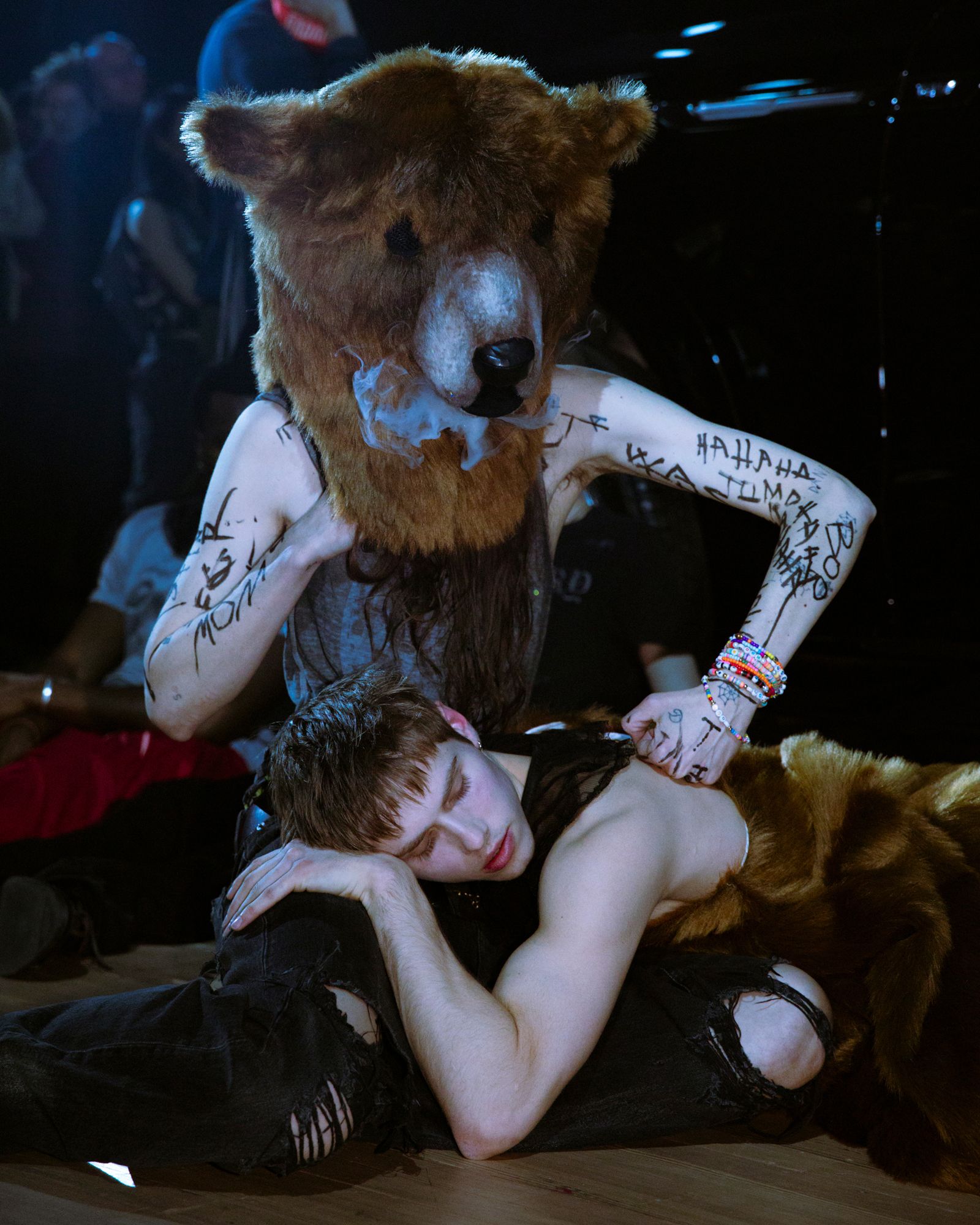 Anne Imhof, DOOM, 2025, with Eliza Douglas (in bear mask) and Toon Lobach