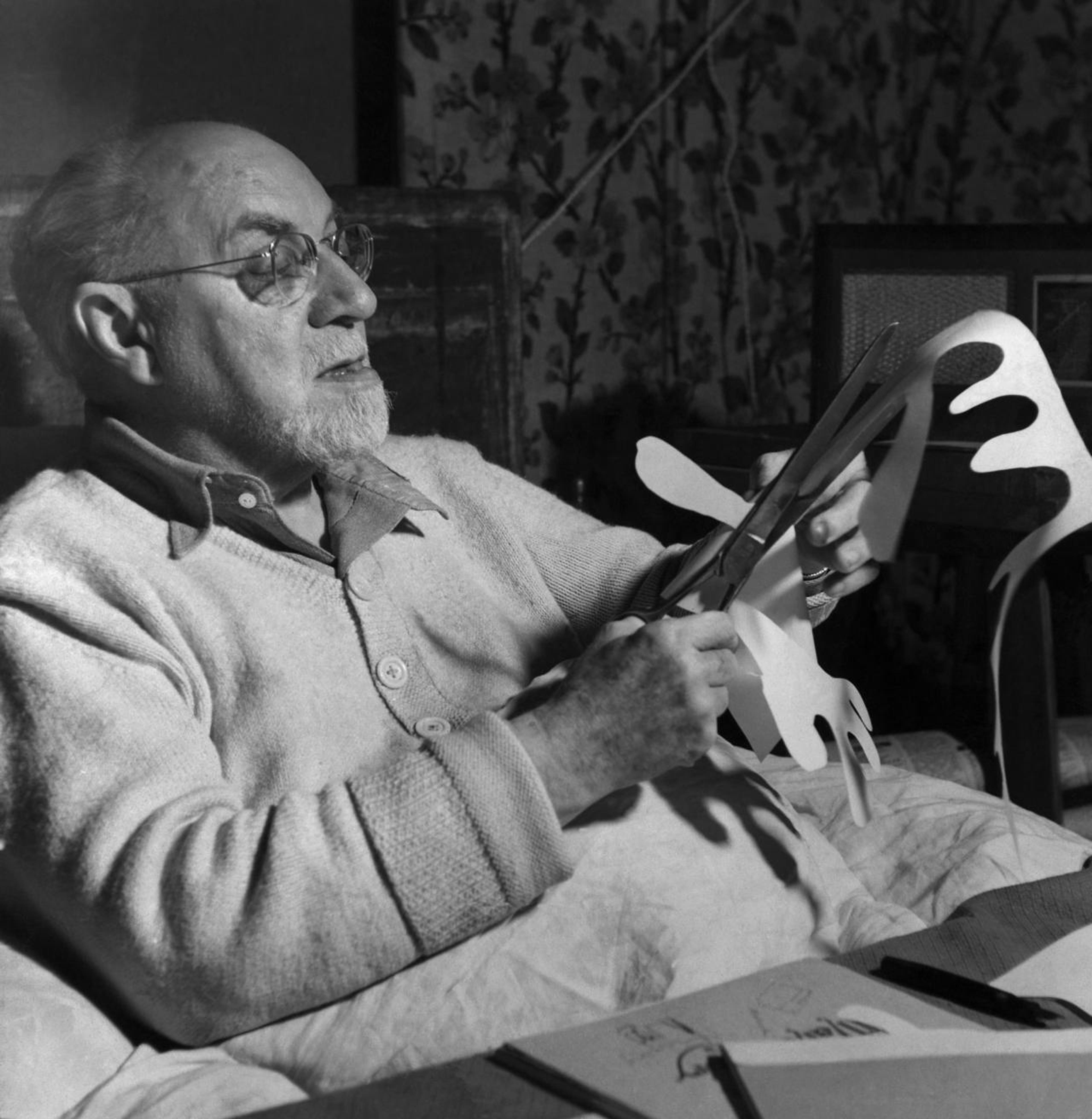 Henri Matisse working on paper cut out, n.d.