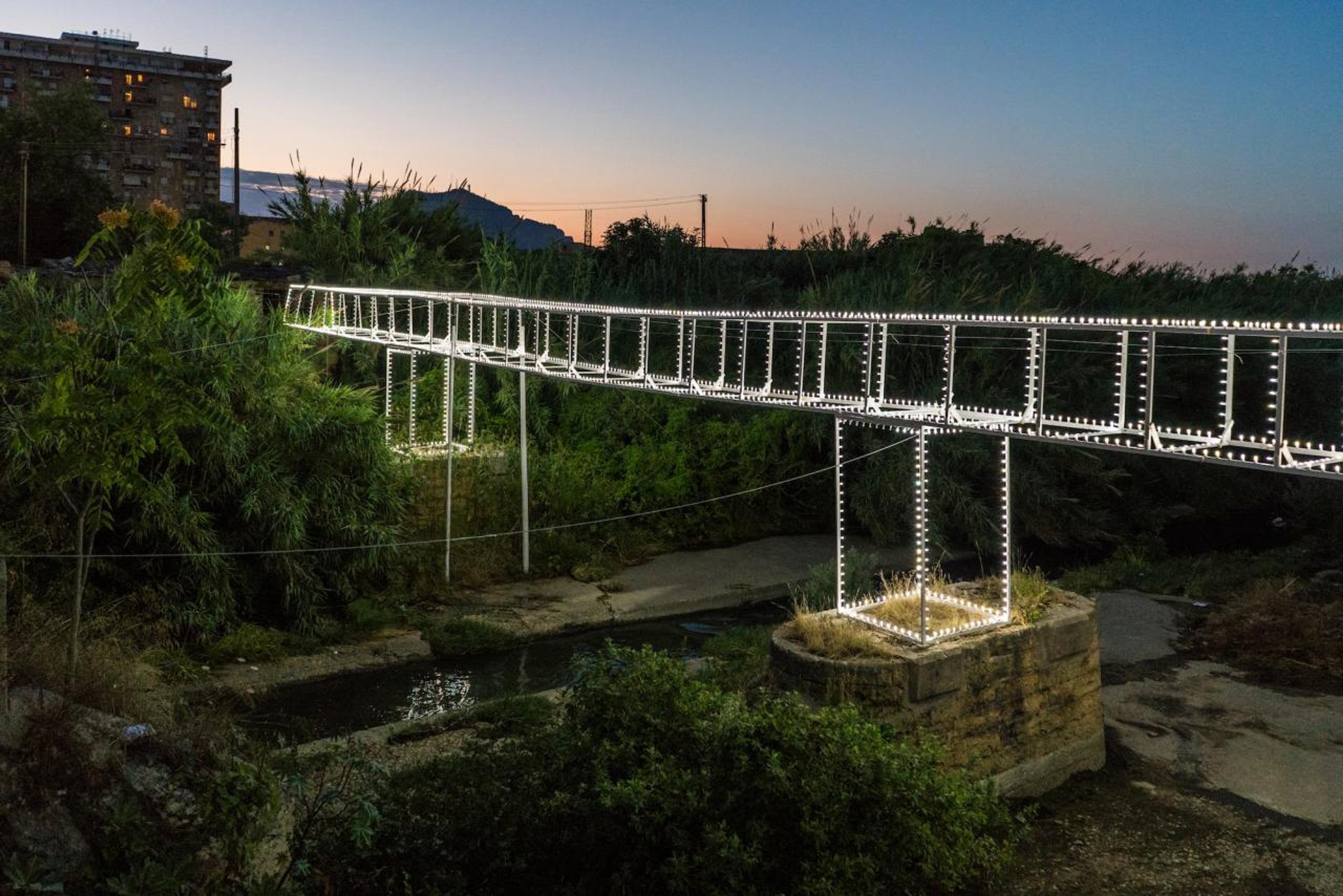 Roberto Collovà, Ponte Luminaria. Giardino di giardini. Azioni sulla Costa Sud, 2018, mixed media, installation view, Oreto River, Palermo